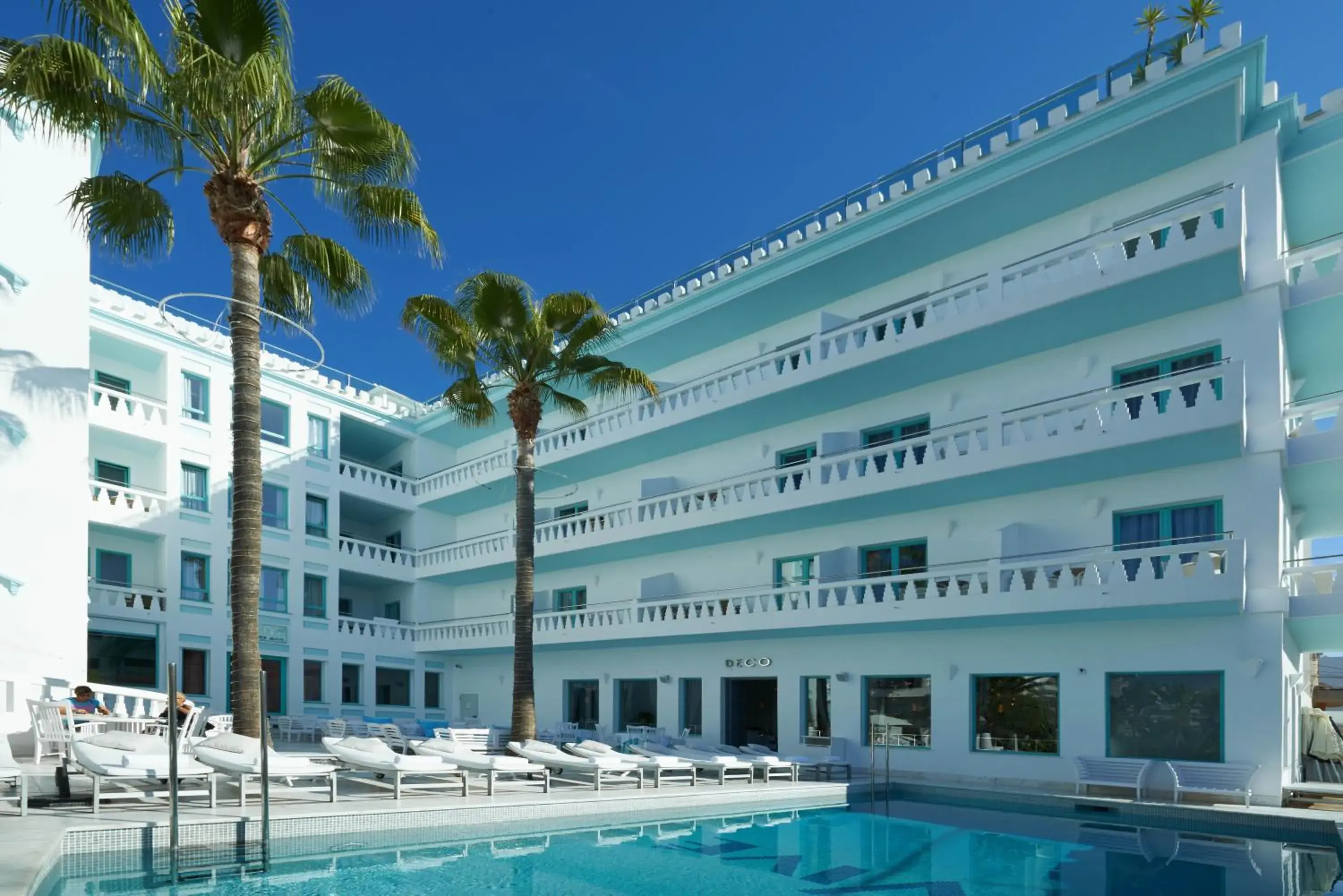 Swimming pool, Property Building in Hotel MiM Ibiza Es Vive - Adults Only