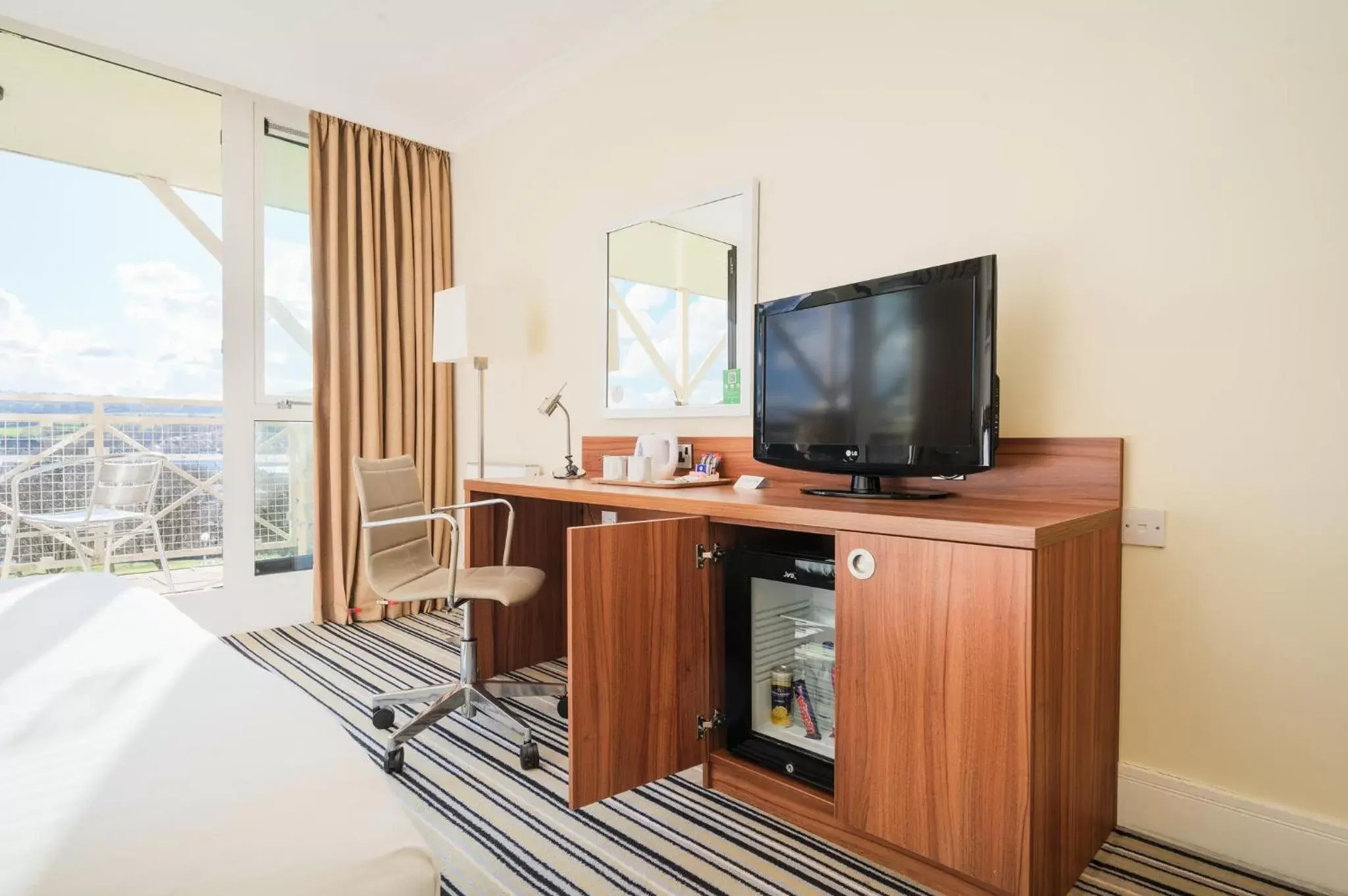 Photo of the whole room, TV/Entertainment Center in Holiday Inn Leeds Brighouse, an IHG Hotel