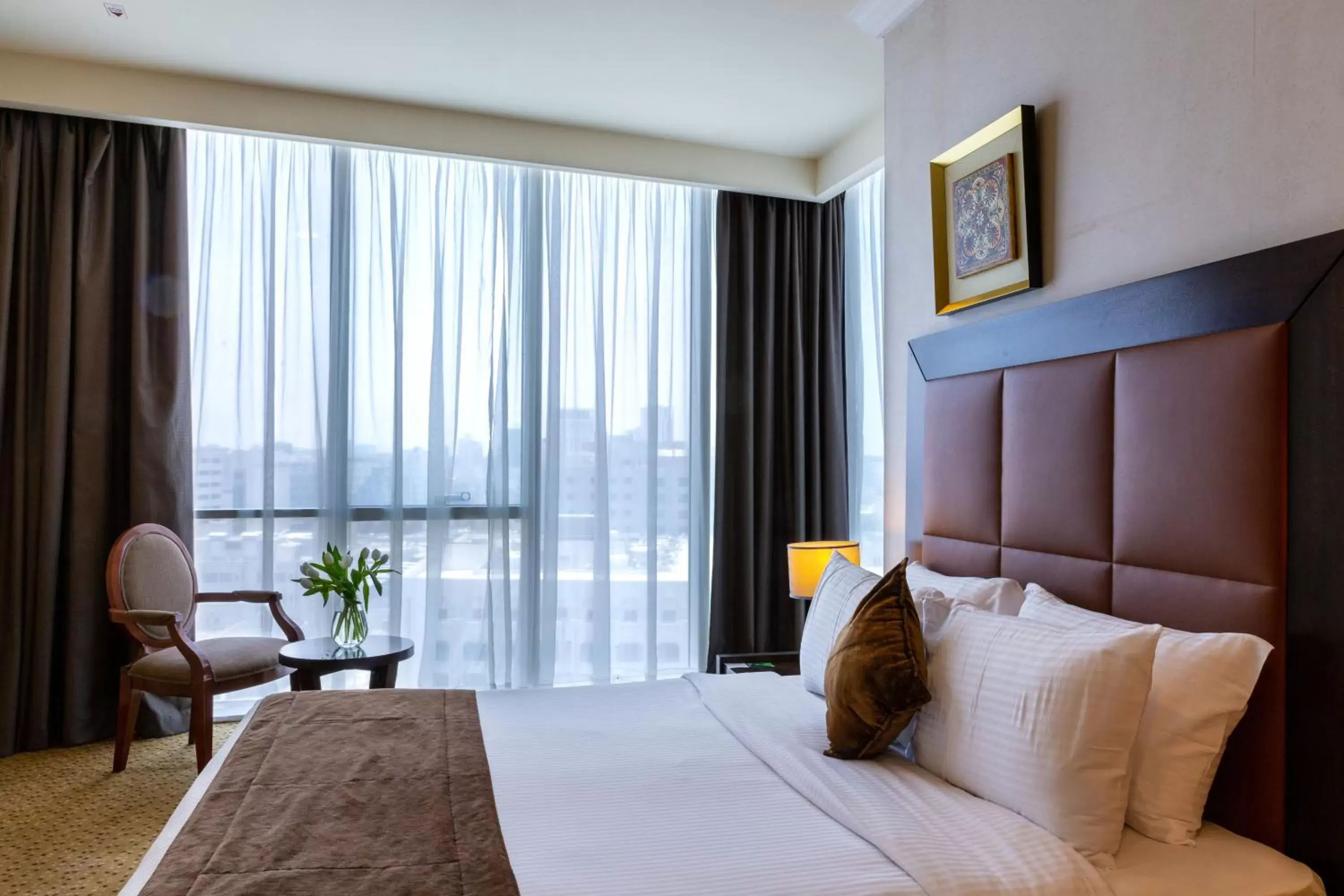 Bedroom, Bed in Kingsgate Hotel Doha by Millennium Hotels.