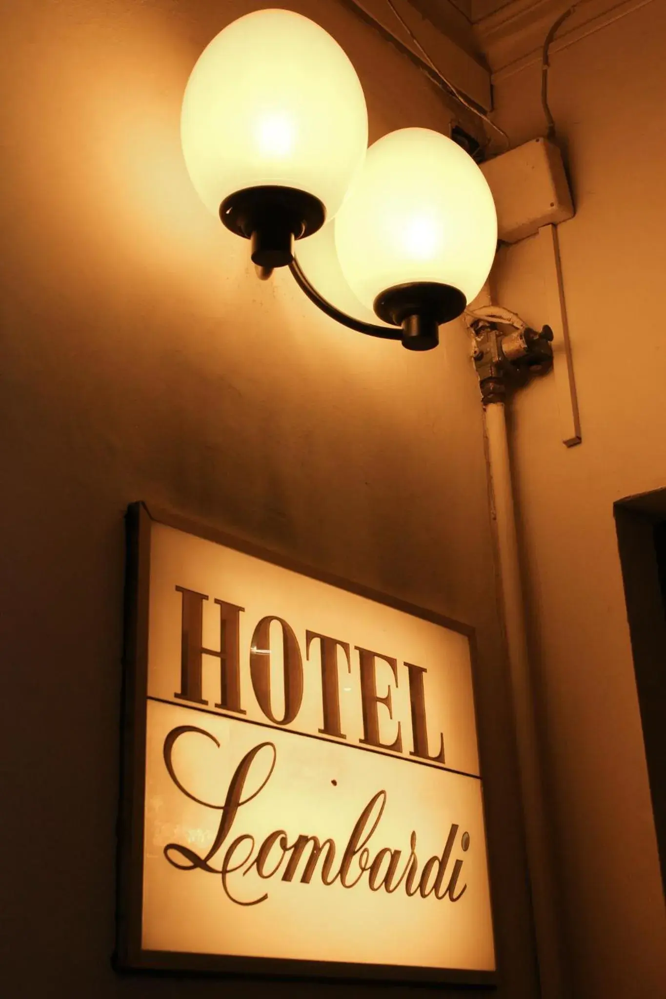 Property logo or sign in Hotel Lombardi