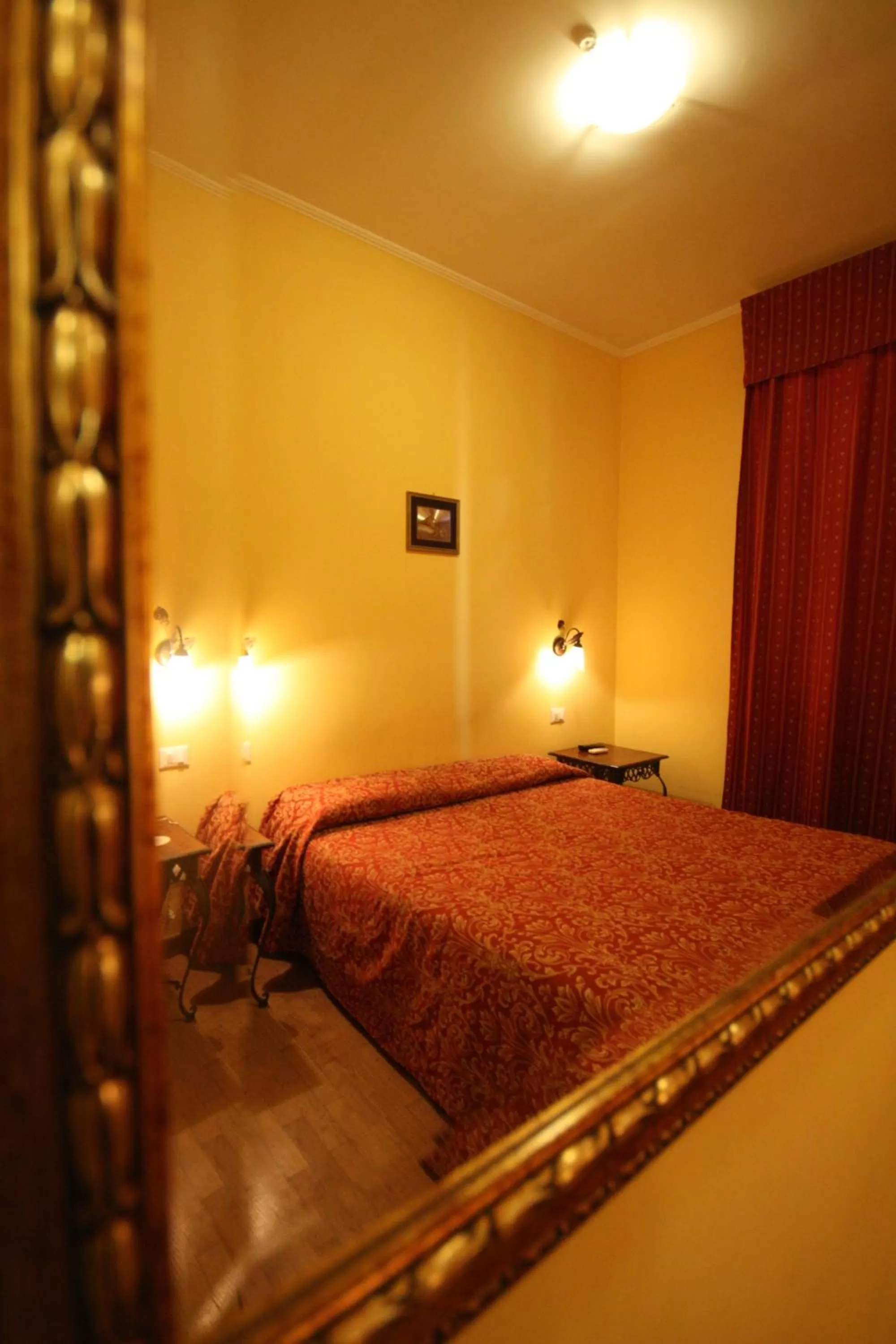 Bed in Hotel Cherubini