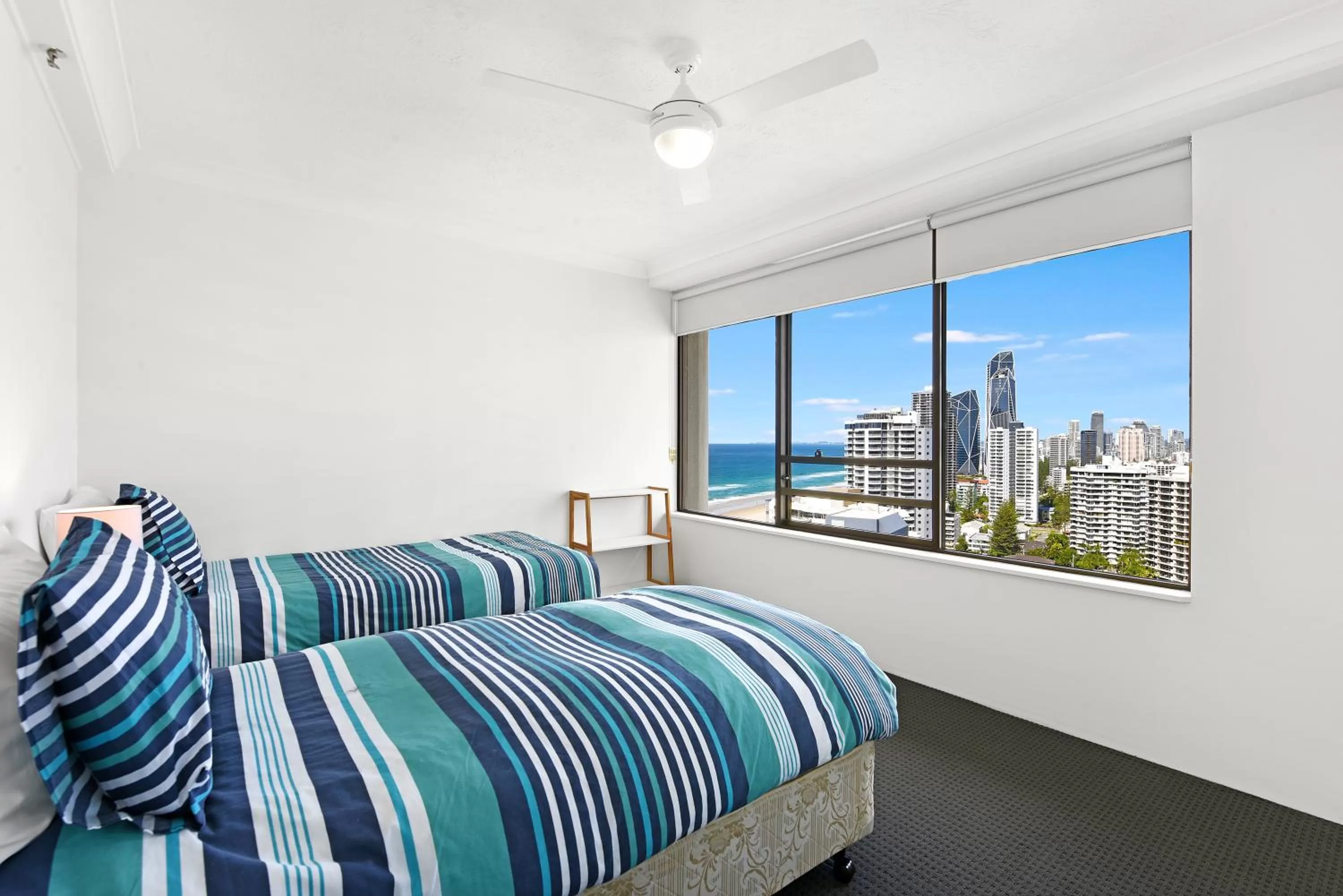 Bed in Surfers Century Oceanside Apartments