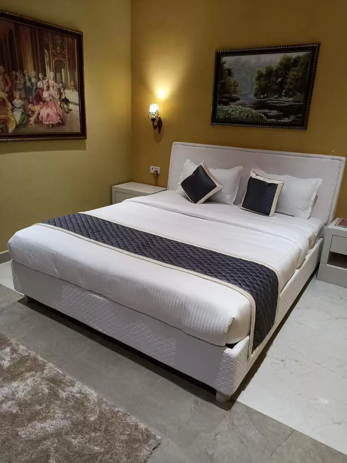 Bed in Sangam Inn & Banquets Bed in Sangam Inn & Banquets