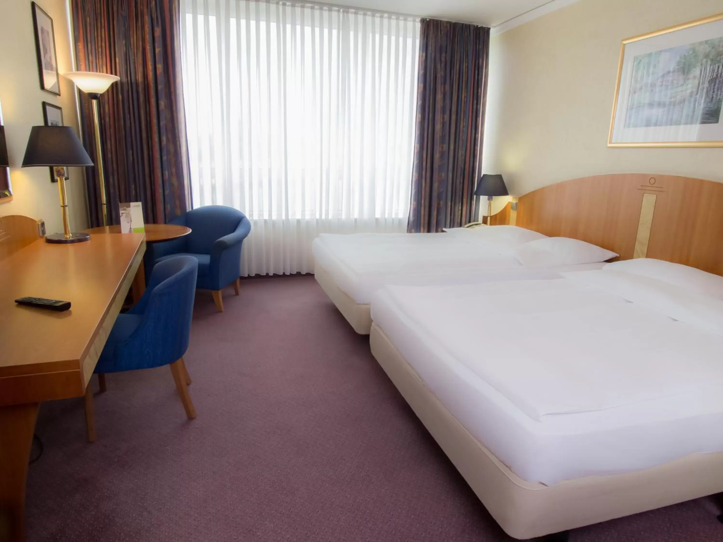 Photo of the whole room, Bed in Lindner Hotel Cottbus
