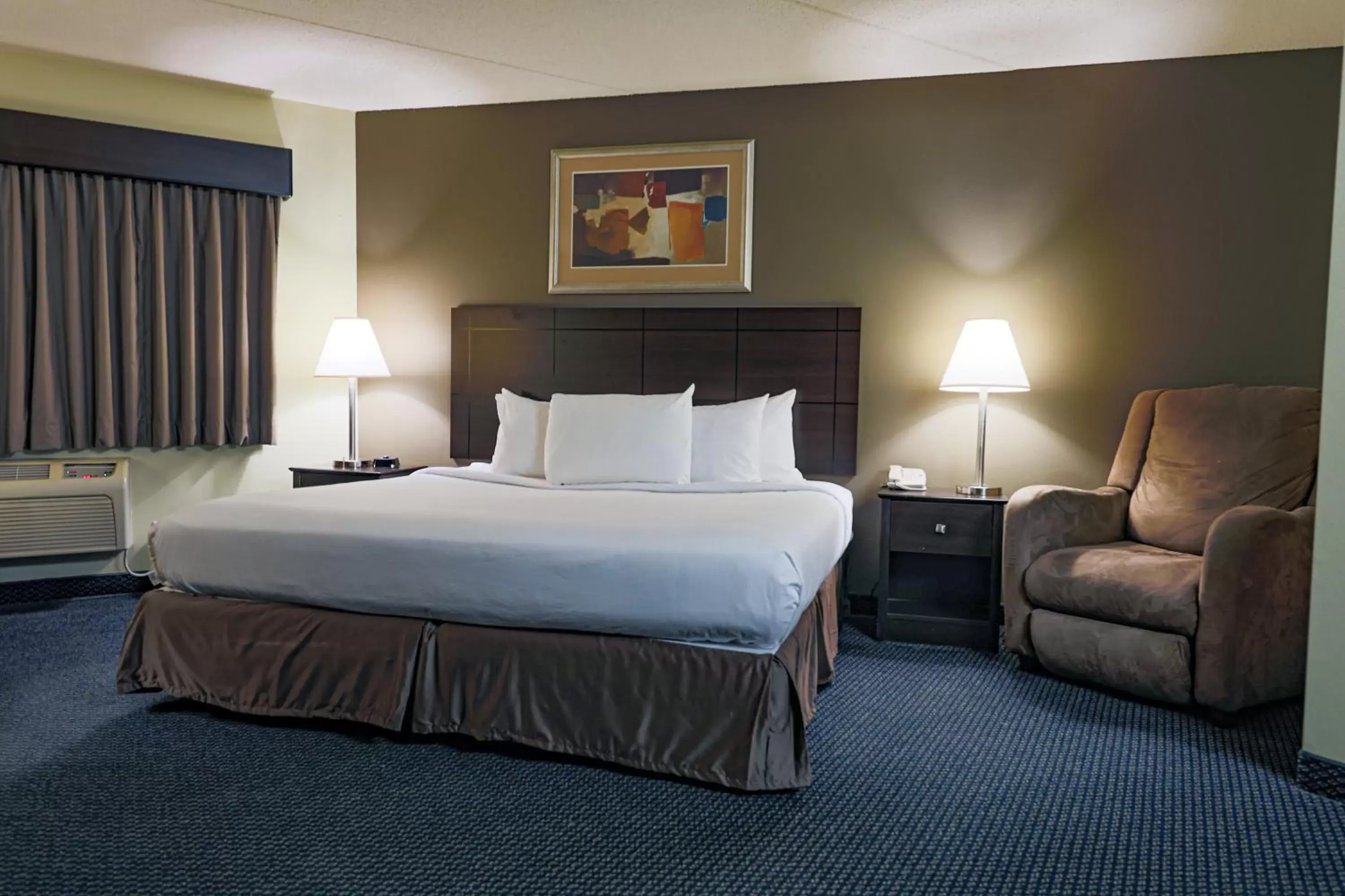 Bed in AmericInn by Wyndham Lincoln South