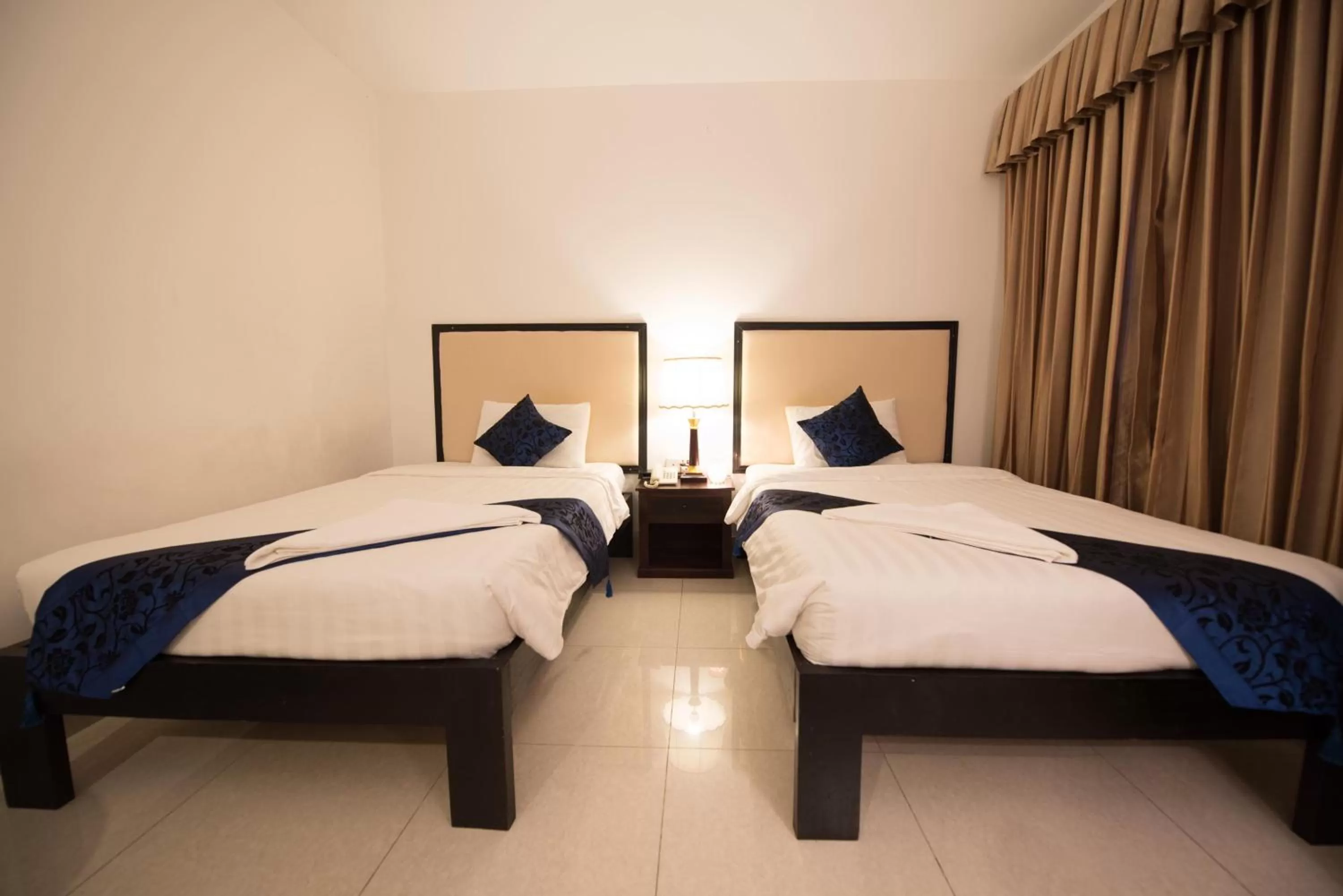 Bed in Homesyn Hotel