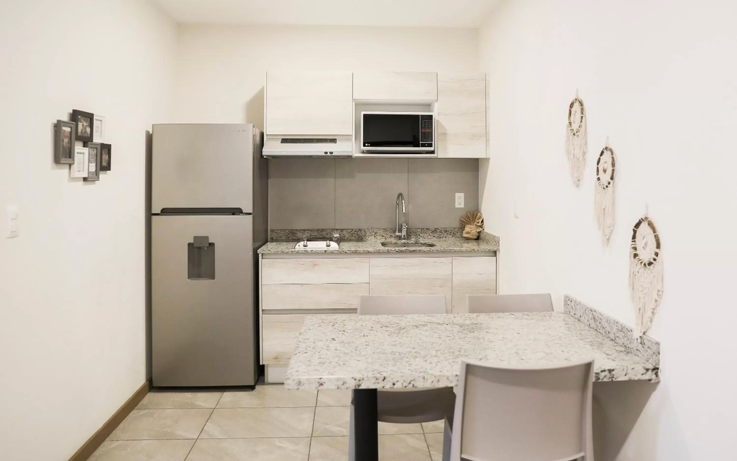 Kitchen/Kitchenette in Grand Fifty Suites