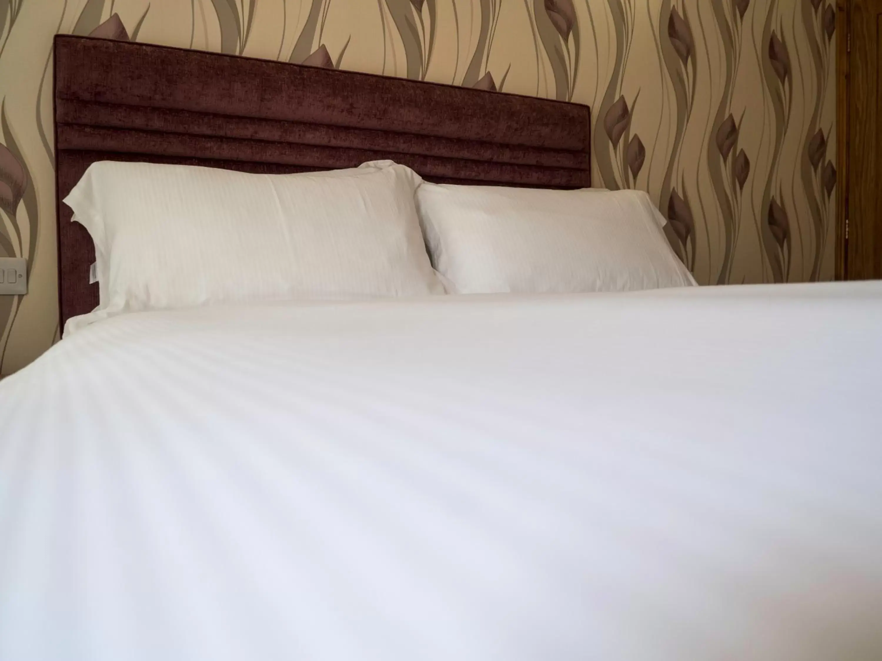 Bed in The Stanwick Hotel