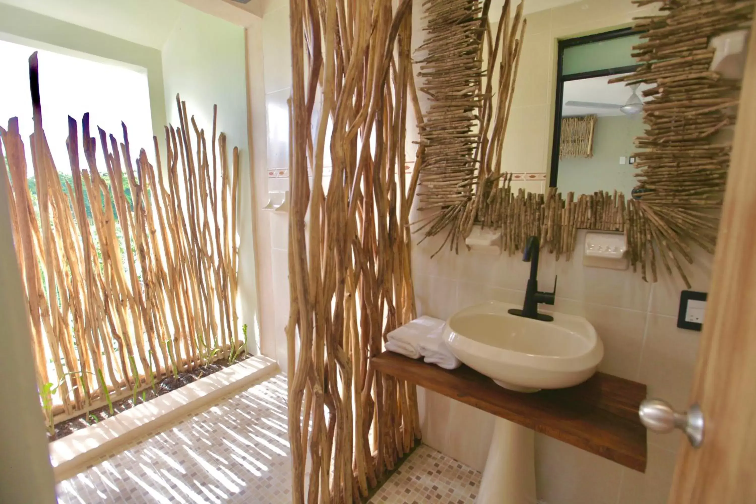 Bathroom in LA TULUMEÑA Boutique Hotel