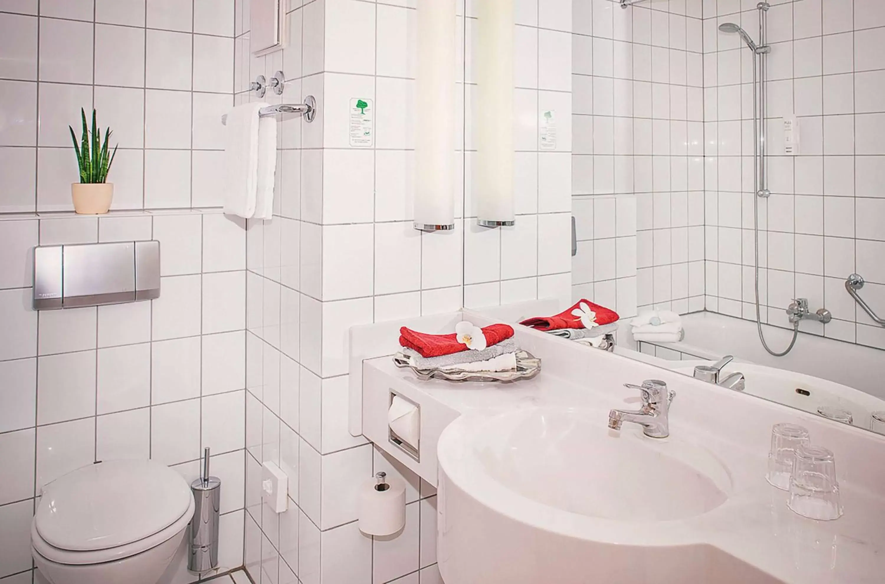 TV and multimedia, Bathroom in Vienna House Easy by Wyndham Limburg