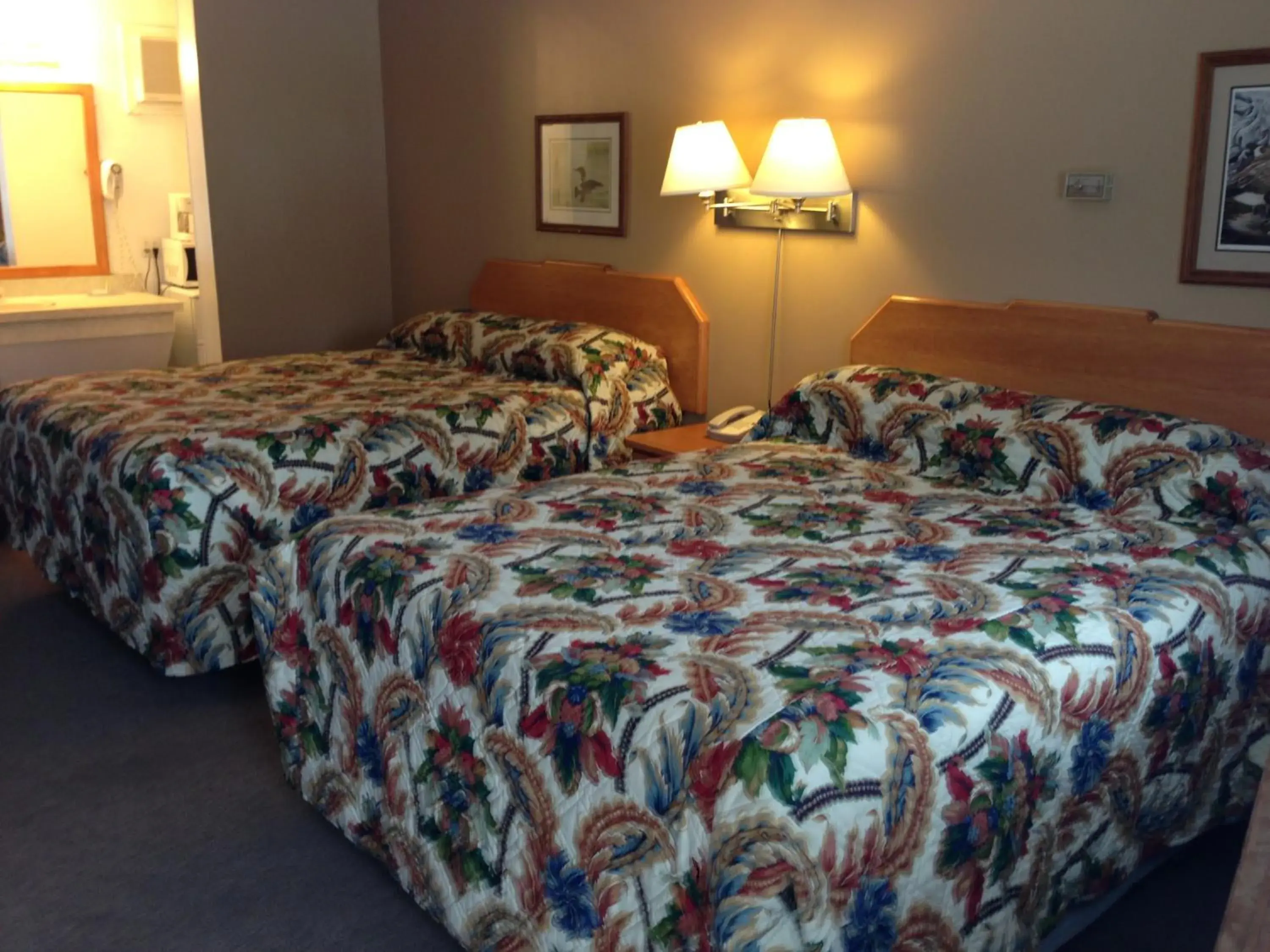 Queen Room with Two Queen Beds - Smoking in Travelodge by Wyndham Moose Jaw