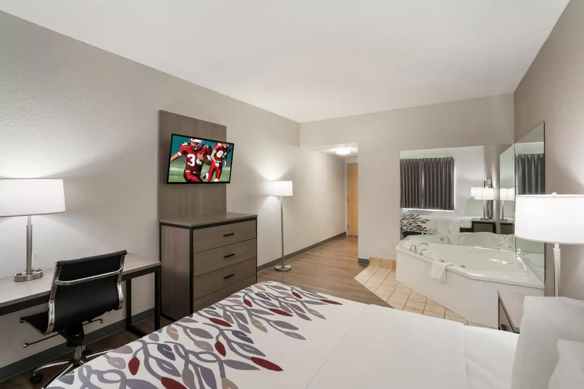 Photo of the whole room, TV/Entertainment Center in Red Roof Inn & Suites Carrollton, GA - West Georgia