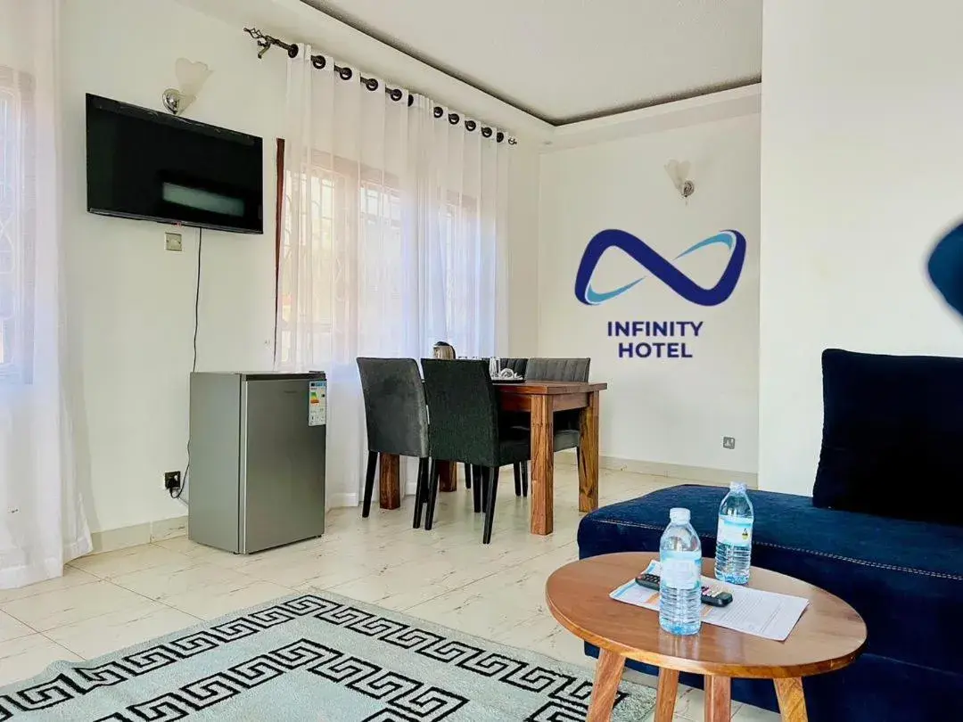 Communal lounge/ TV room, TV/Entertainment Center in Infinity Hotel Kampala