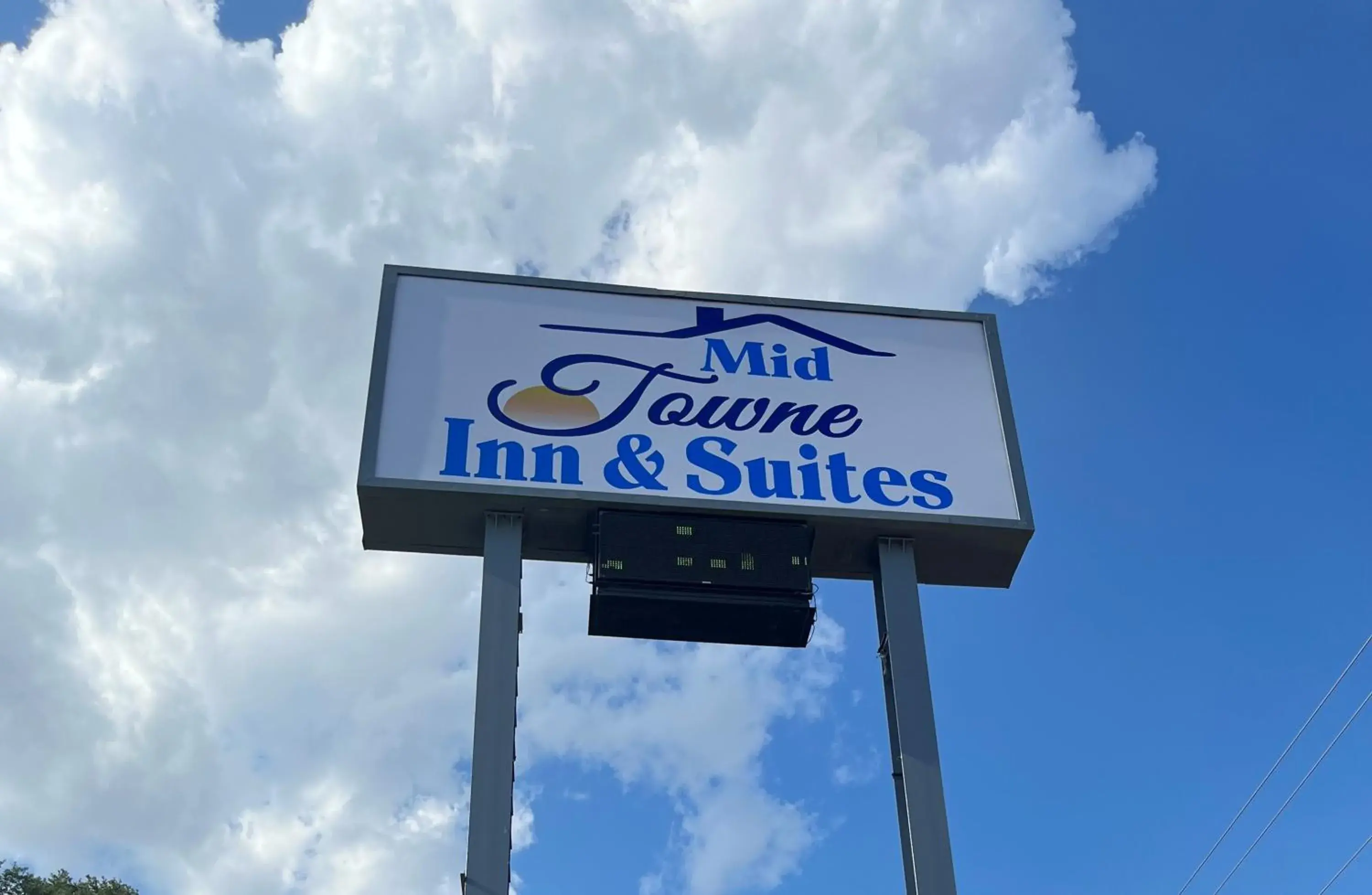 Property logo or sign in Mid Towne Inn & Suites