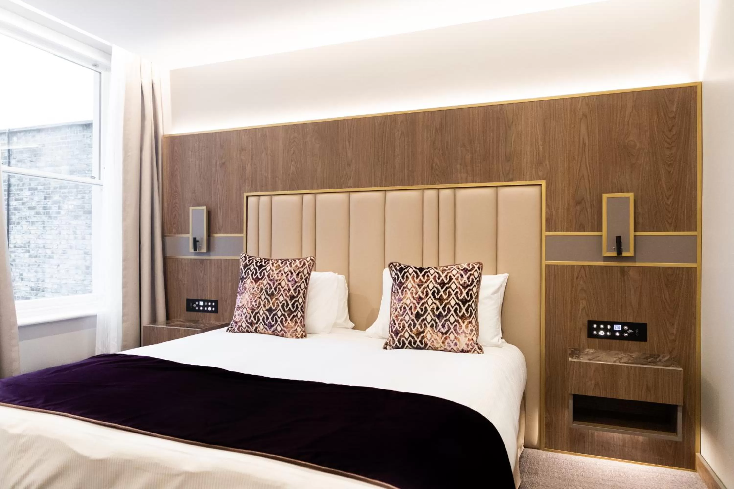 Bed in Merit Kensington Hotel