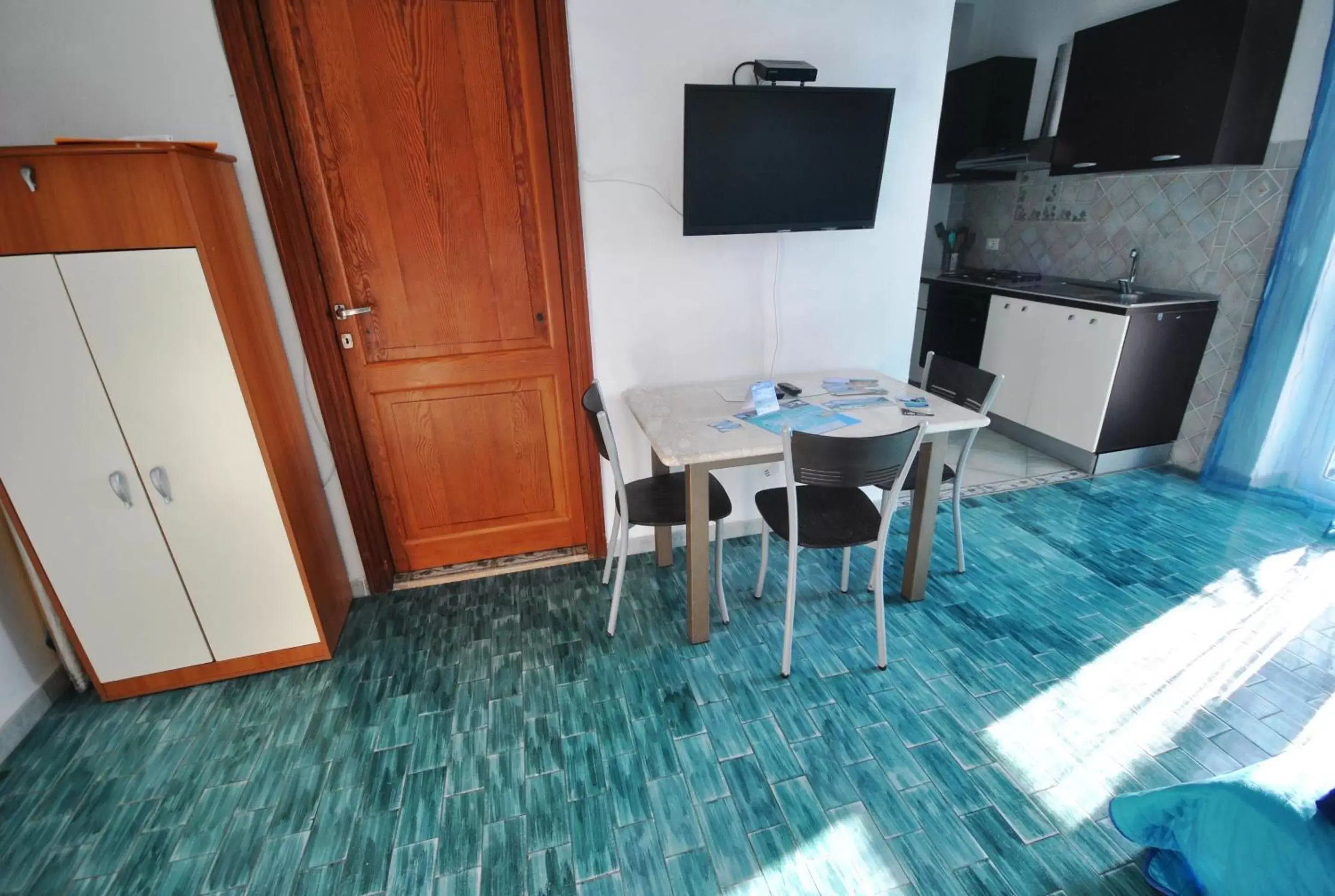 Dining area, TV/Entertainment Center in Holiday Residence Rifugio