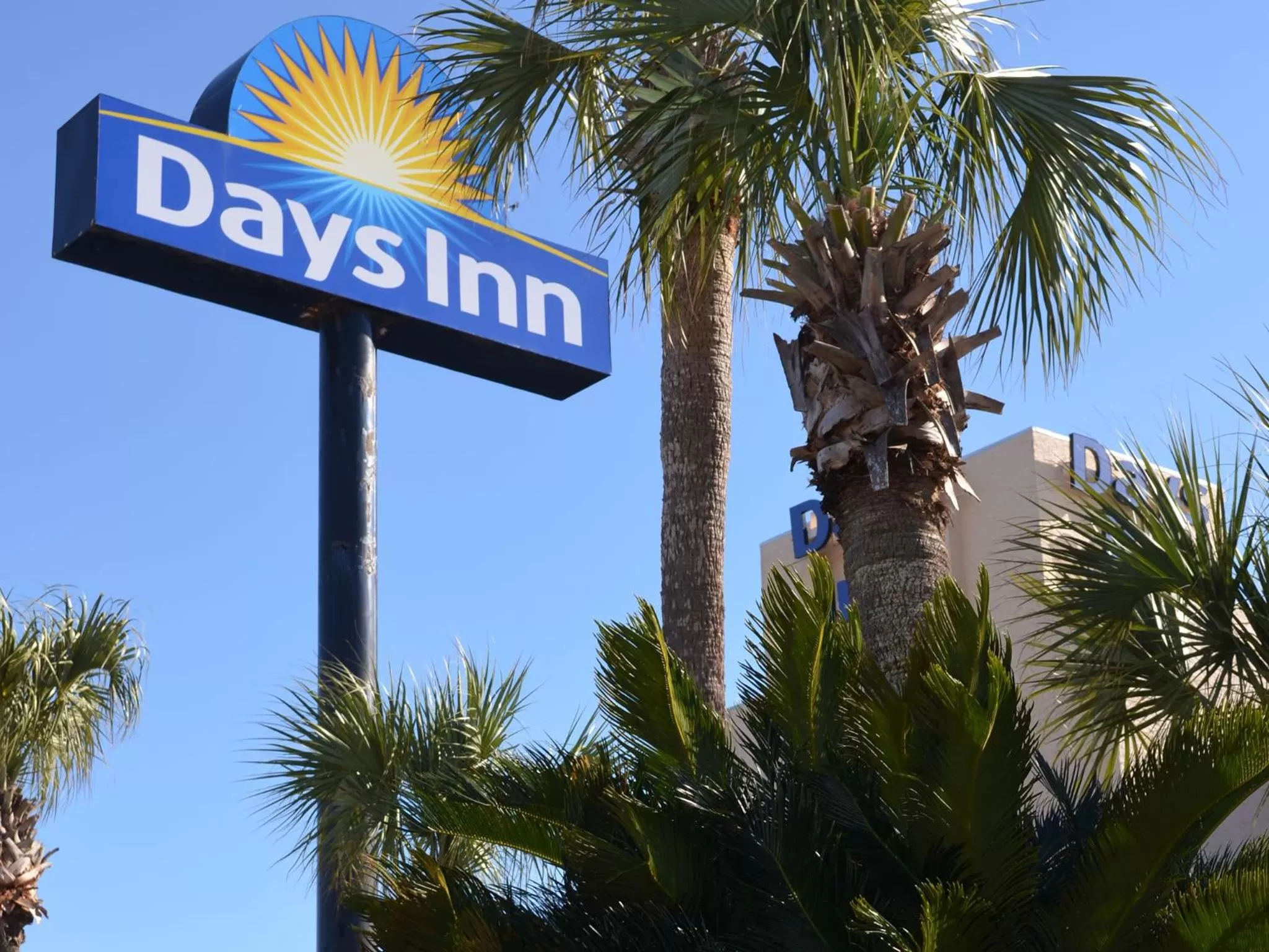 Property logo or sign in Days Inn by Wyndham Panama City Beach Beachfront Resort