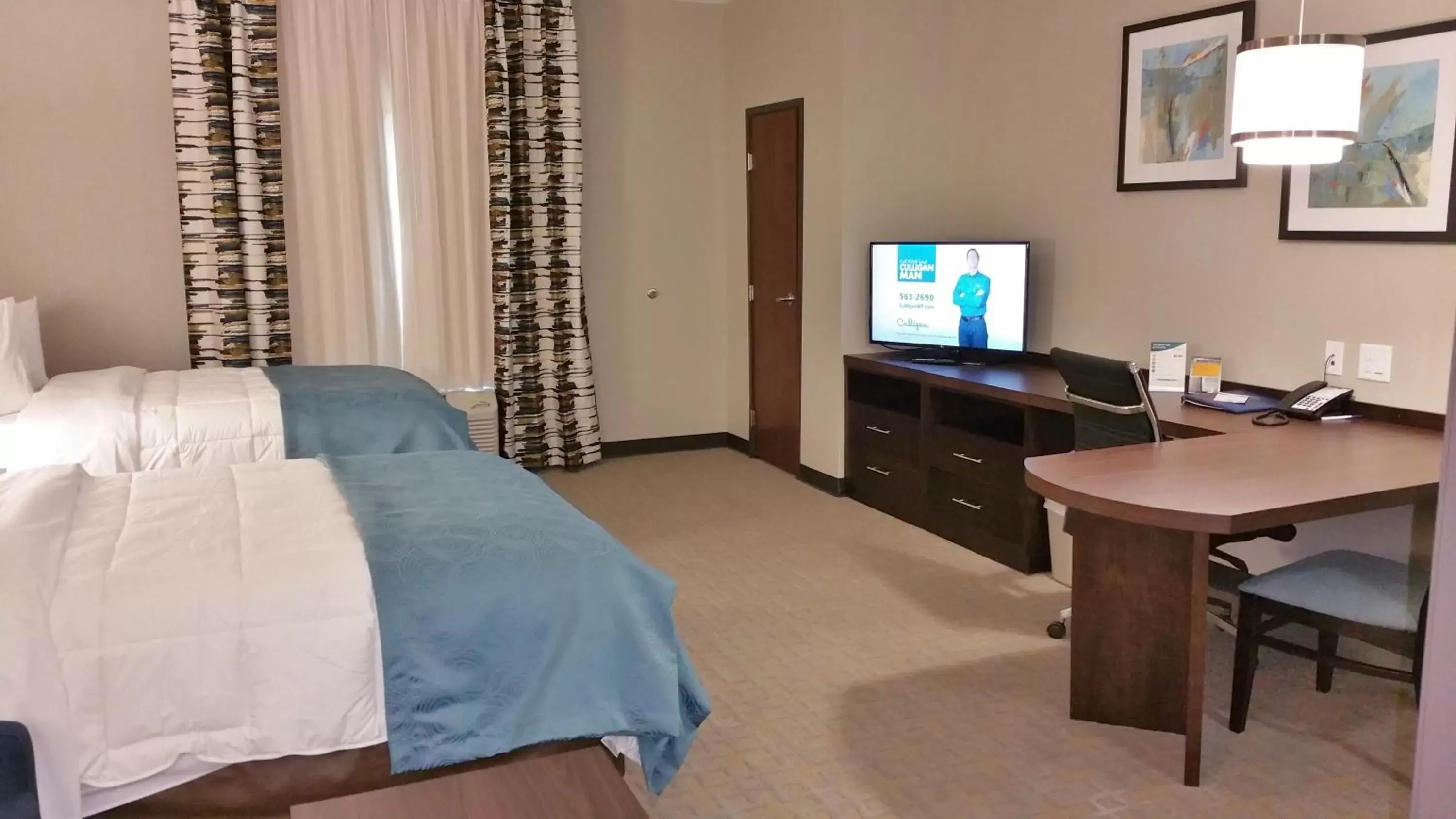 Photo of the whole room, TV/Entertainment Center in MainStay Suites Midland