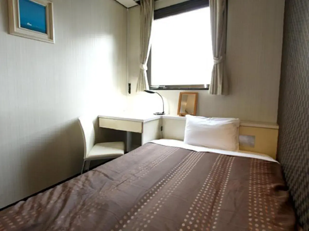 Bed in HOTEL LiVEMAX BUDGET Shinosaka