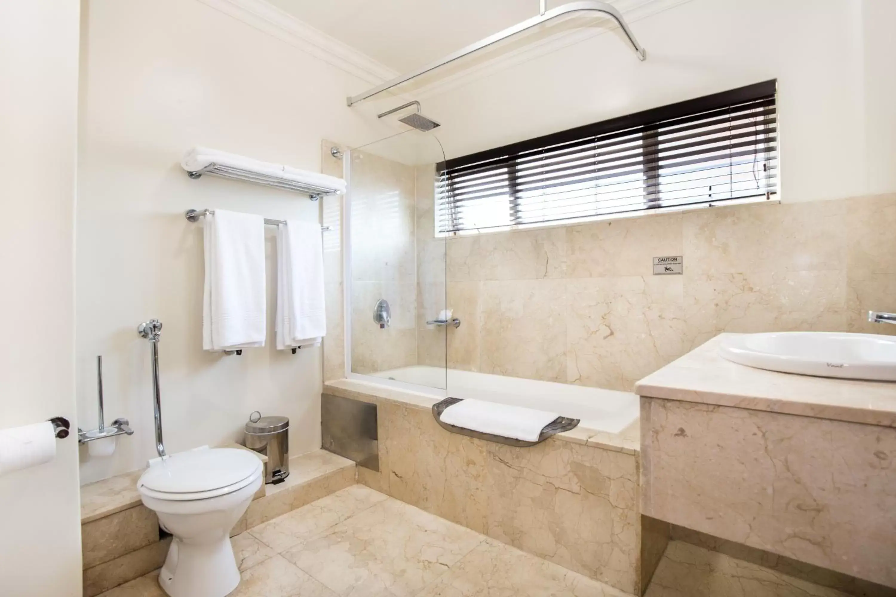 Bathroom in Belaire Suites Hotel