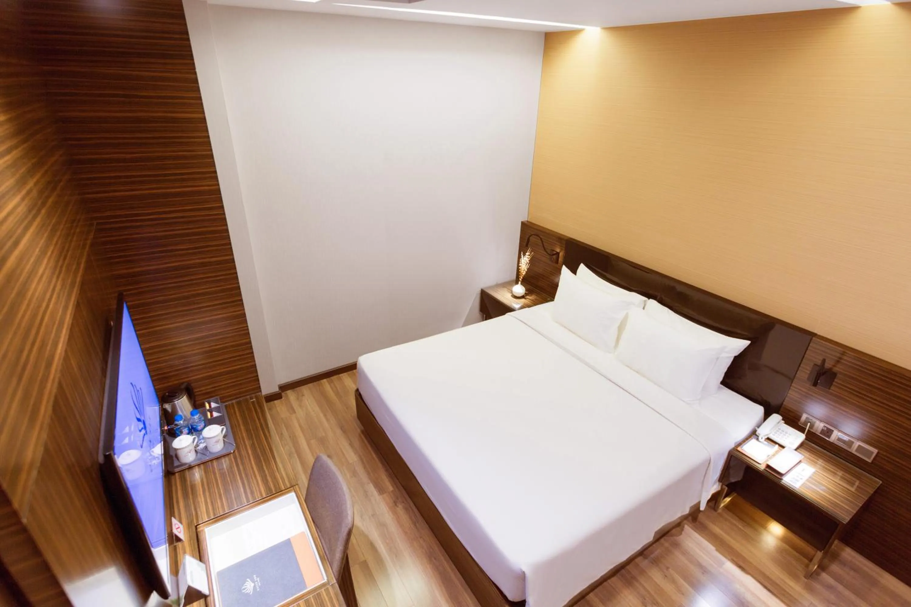 Bed in Queen Ann Hotel