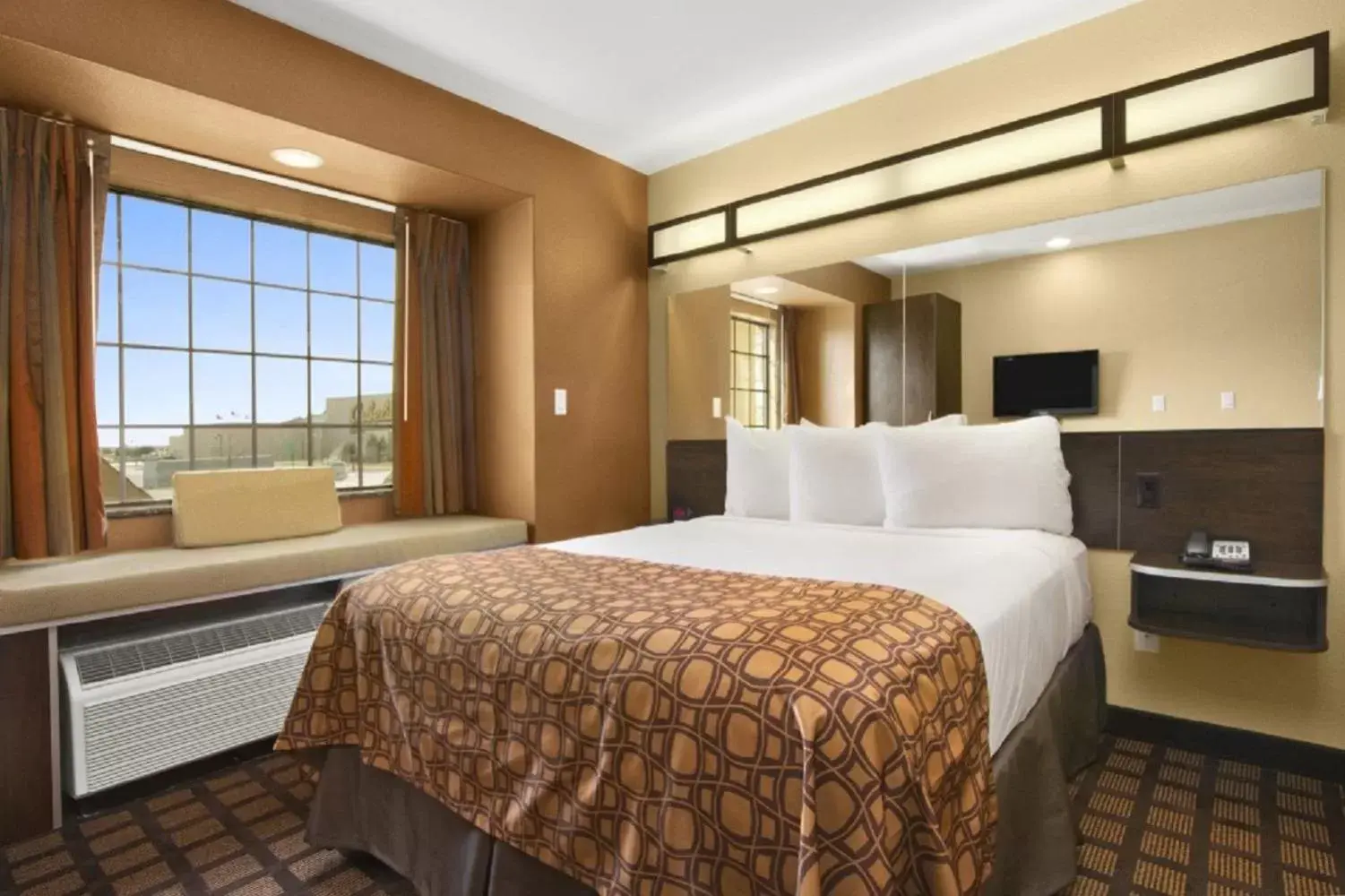 Bed in Microtel Inn & Suites by Wyndham Buda Austin South