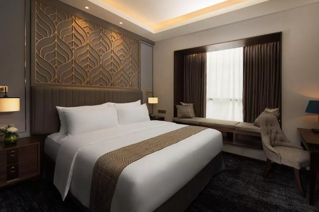 Bed in Sutasoma Hotel