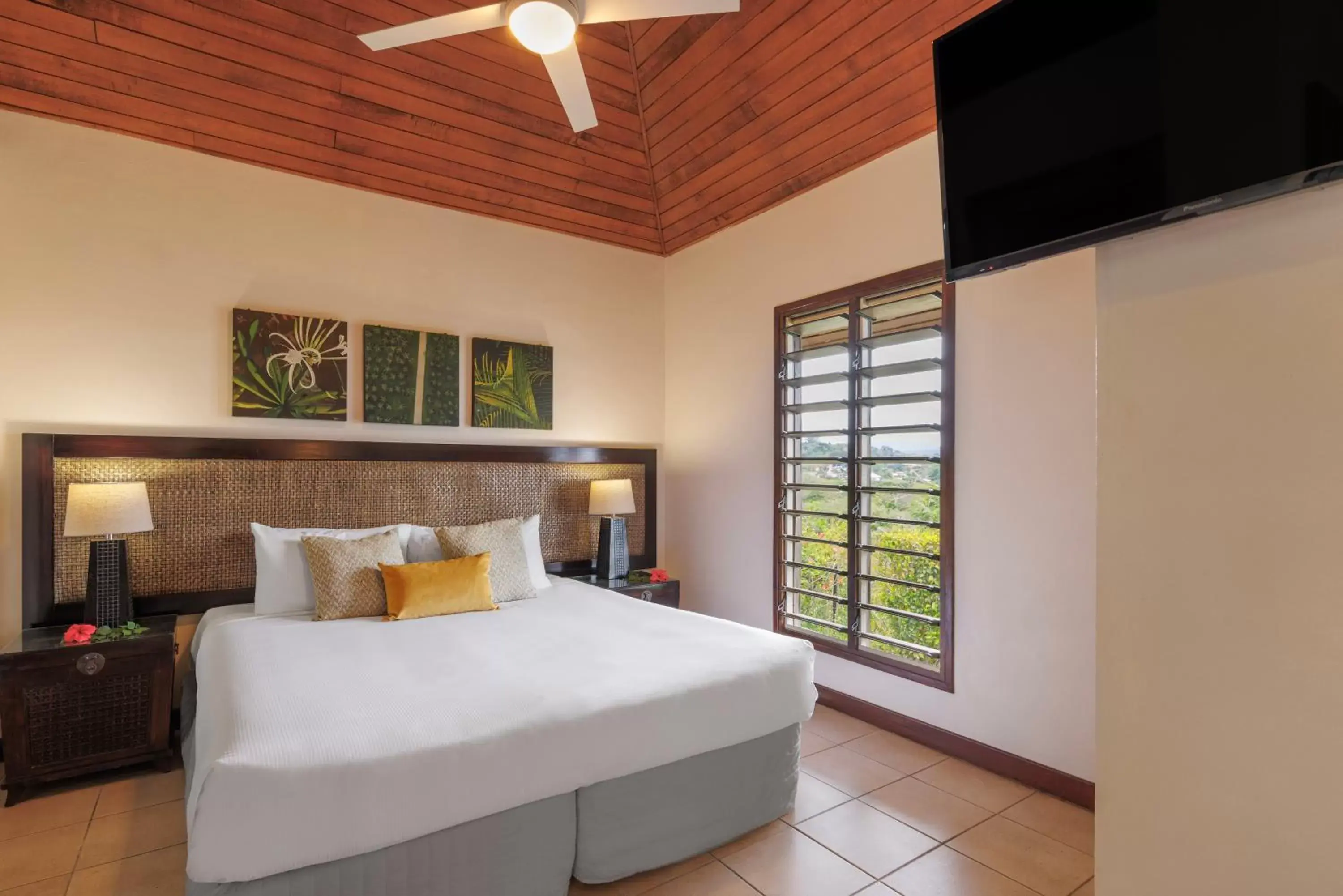 Bed in Mangoes Resort