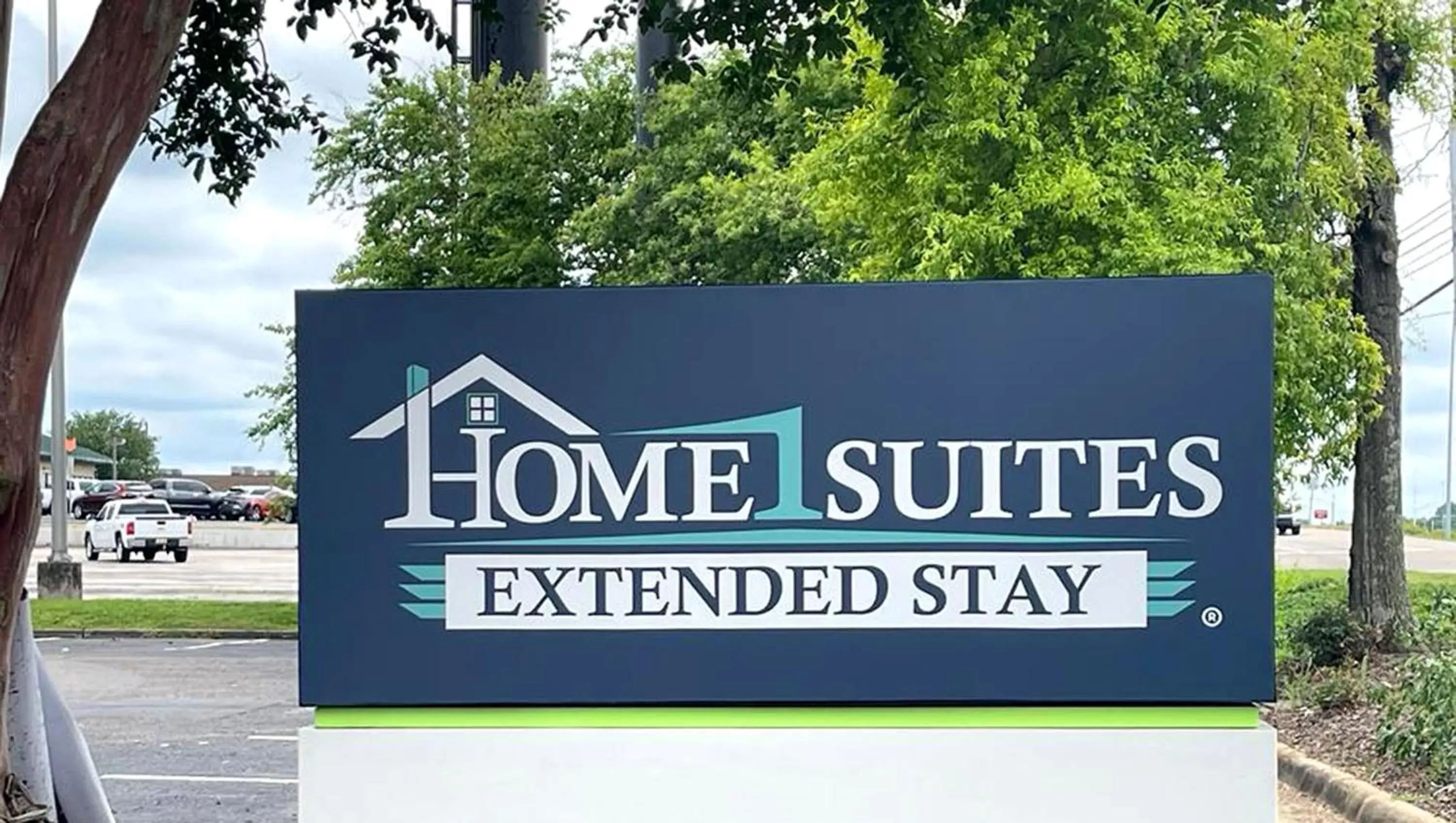Property building, Property Logo/Sign in Home 1 Suites Extended Stay