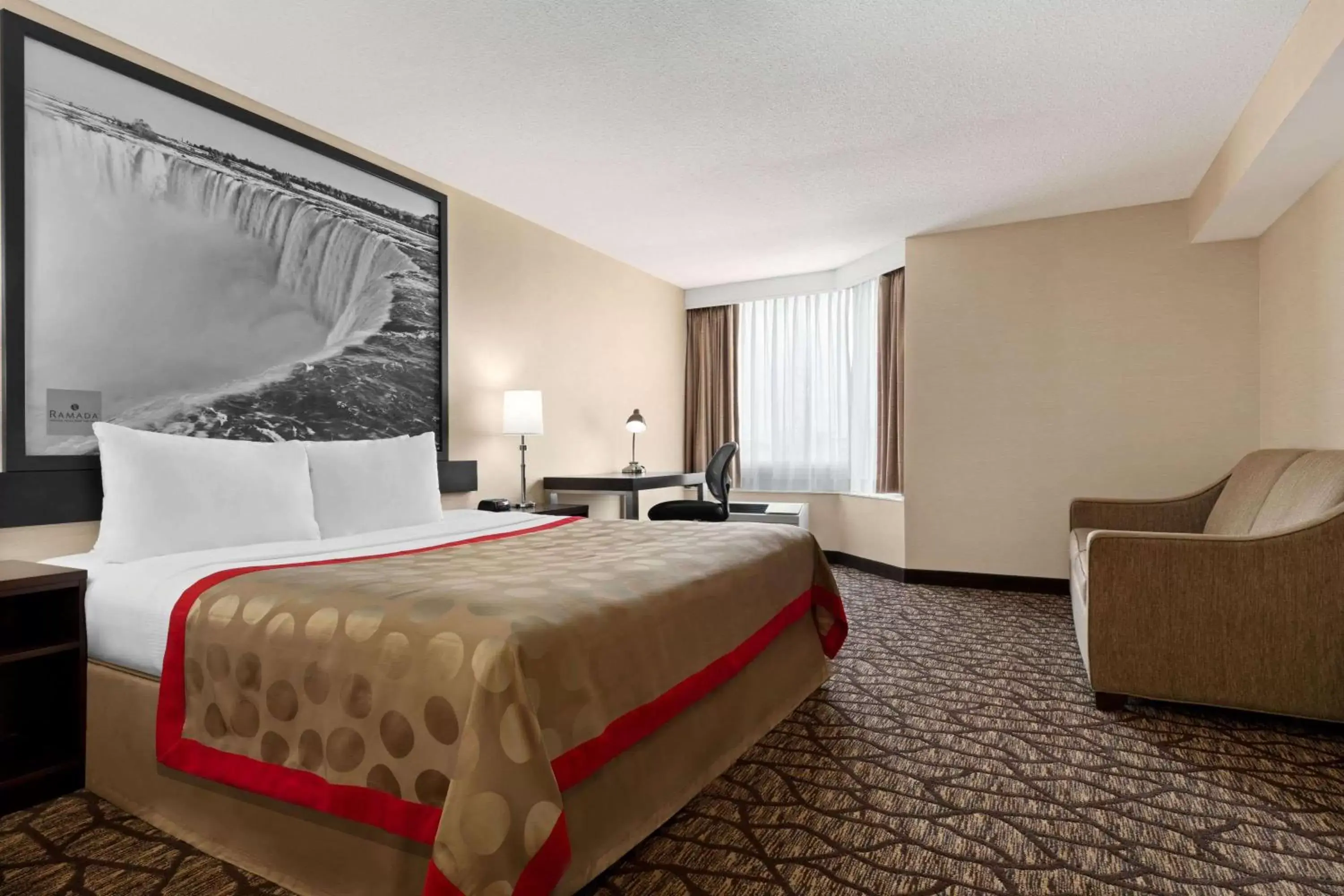 Photo of the whole room, Bed in Ramada By Wyndham Niagara Falls near the Falls