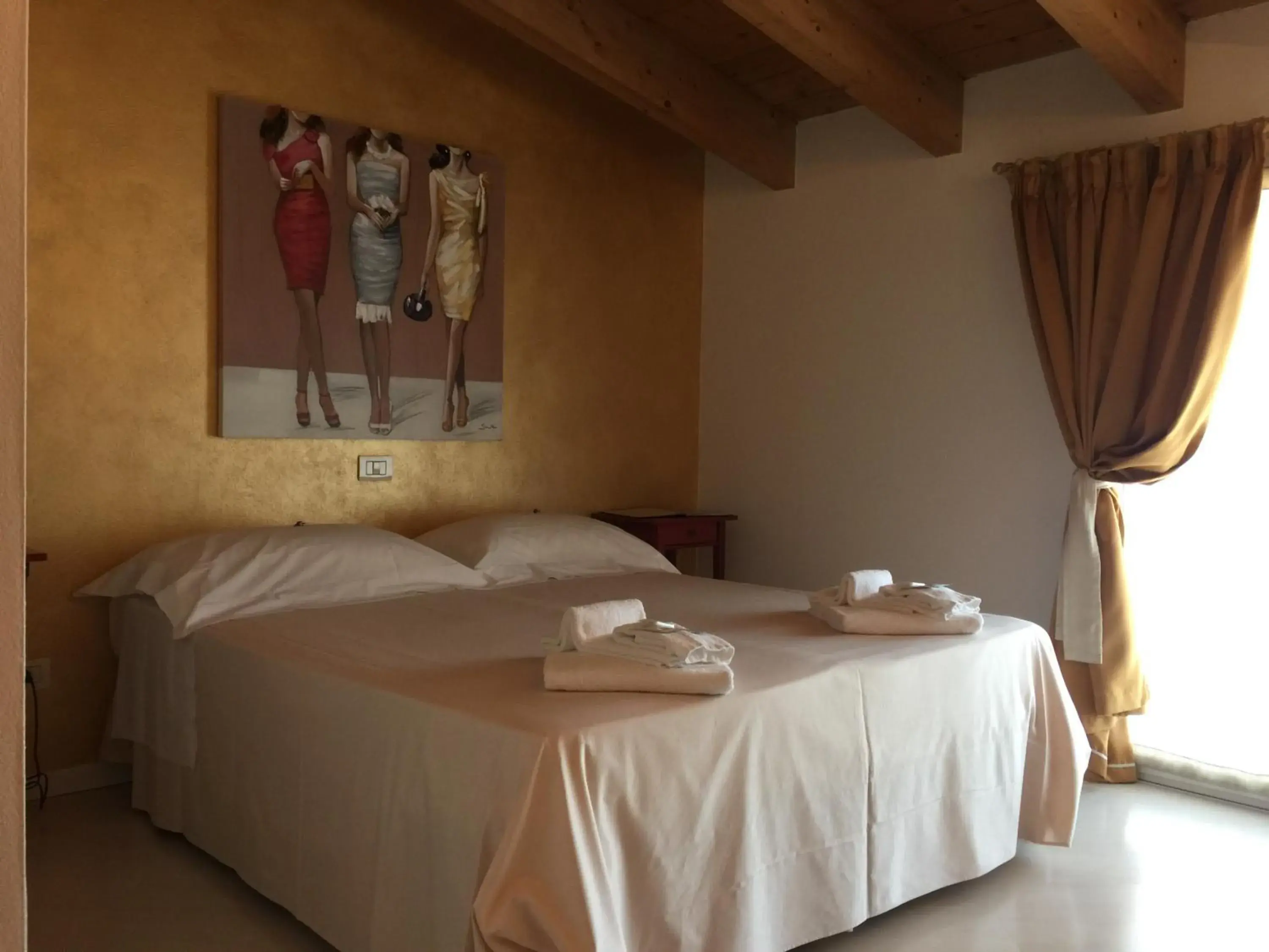 Bed in Il Girasole High Quality Inn