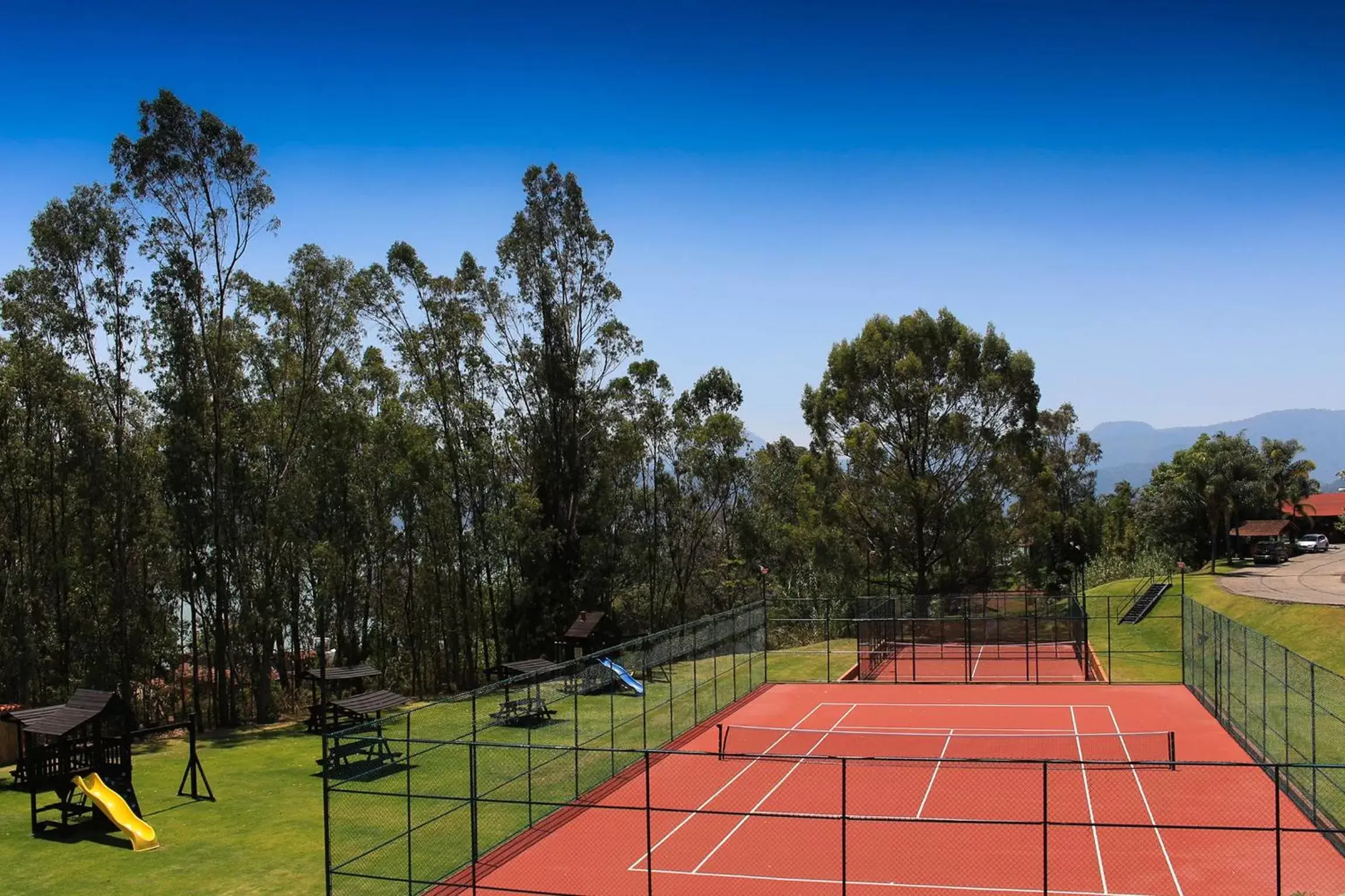 Tennis court in El Santuario Resort & Spa