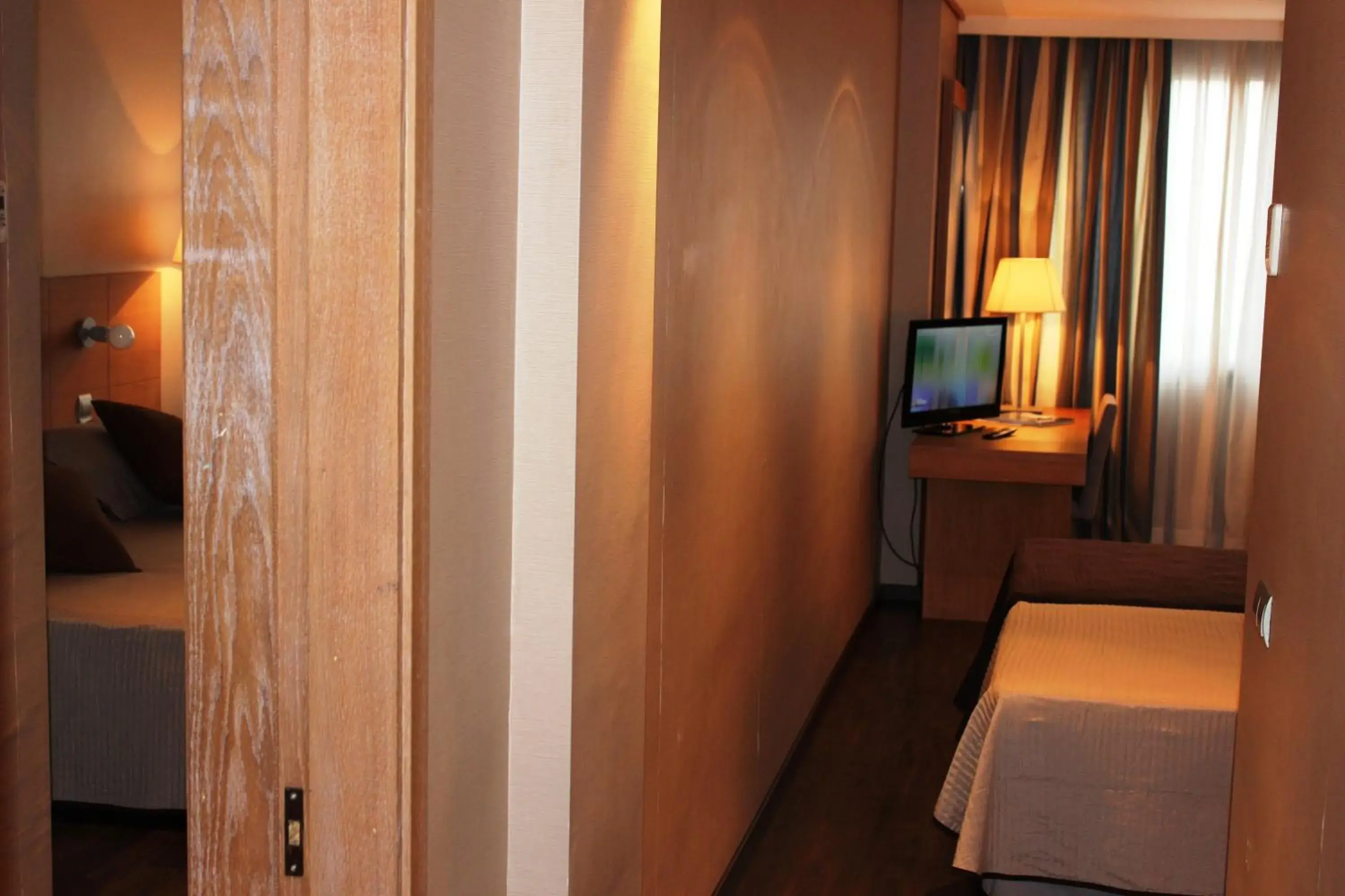 Photo of the whole room, TV/Entertainment Center in Eurohotel Castellon