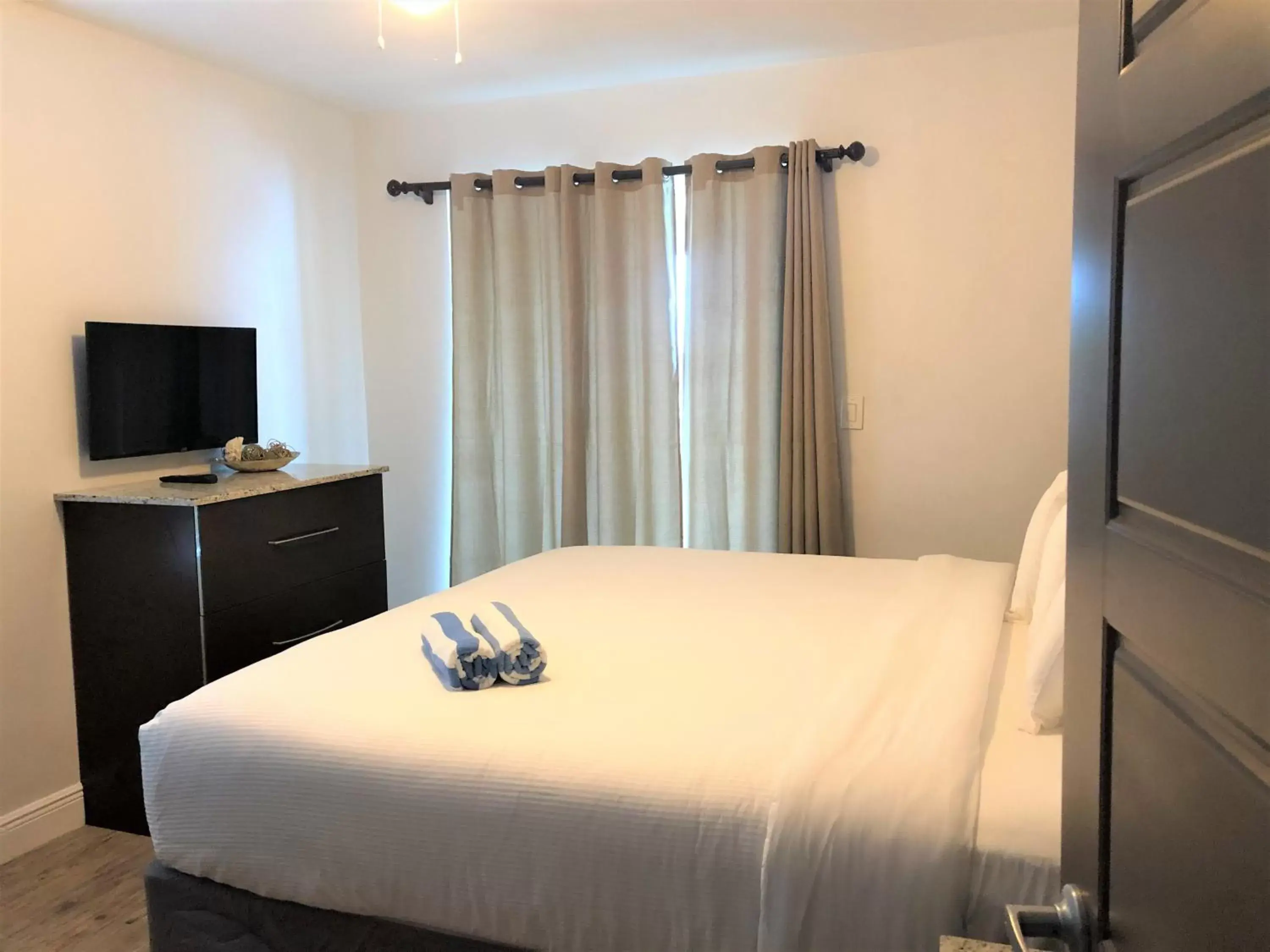 Bed in Caribbean Resort Suites