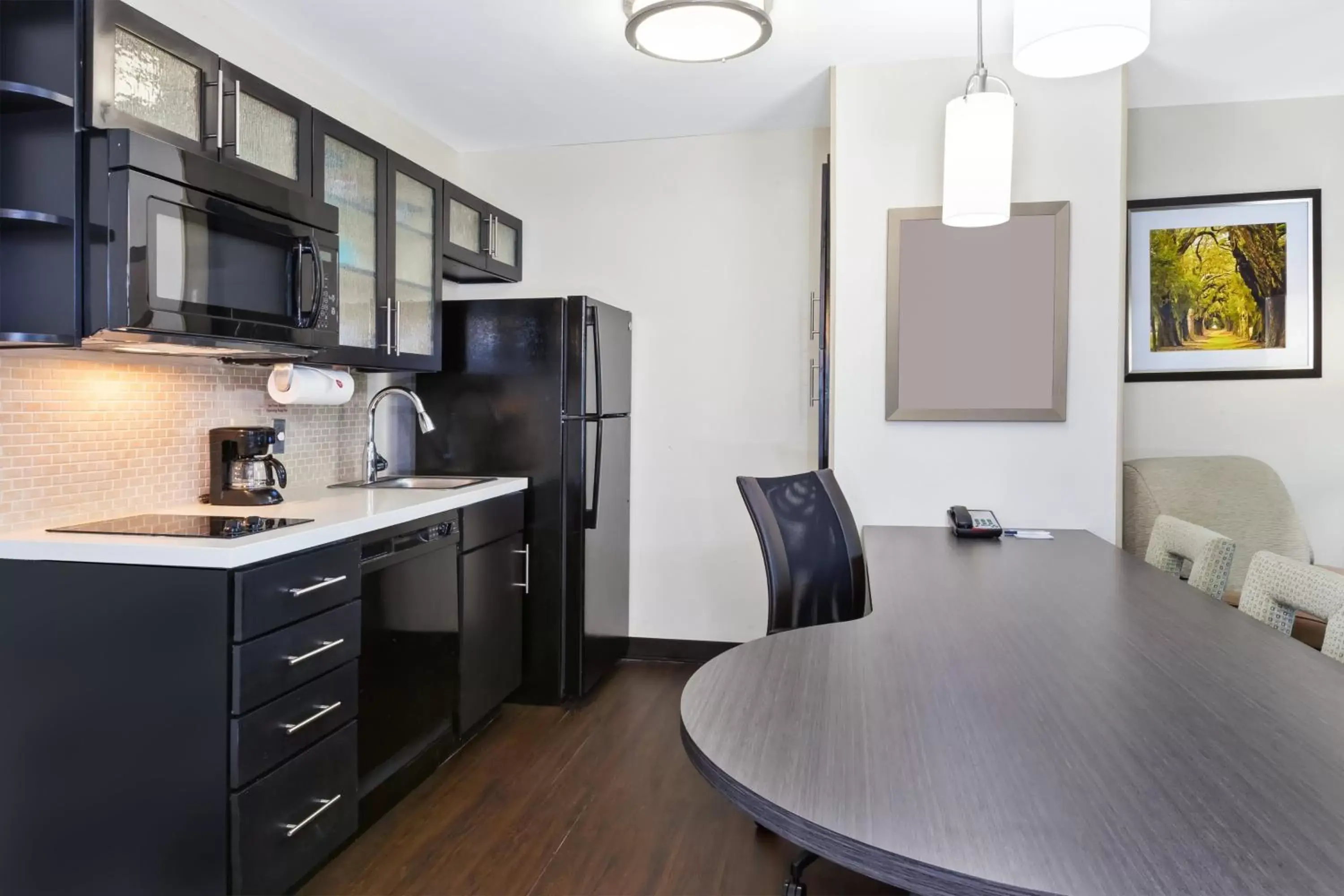 Photo of the whole room, Kitchen/Kitchenette in Candlewood Suites Huntersville-Lake Norman Area, an IHG Hotel