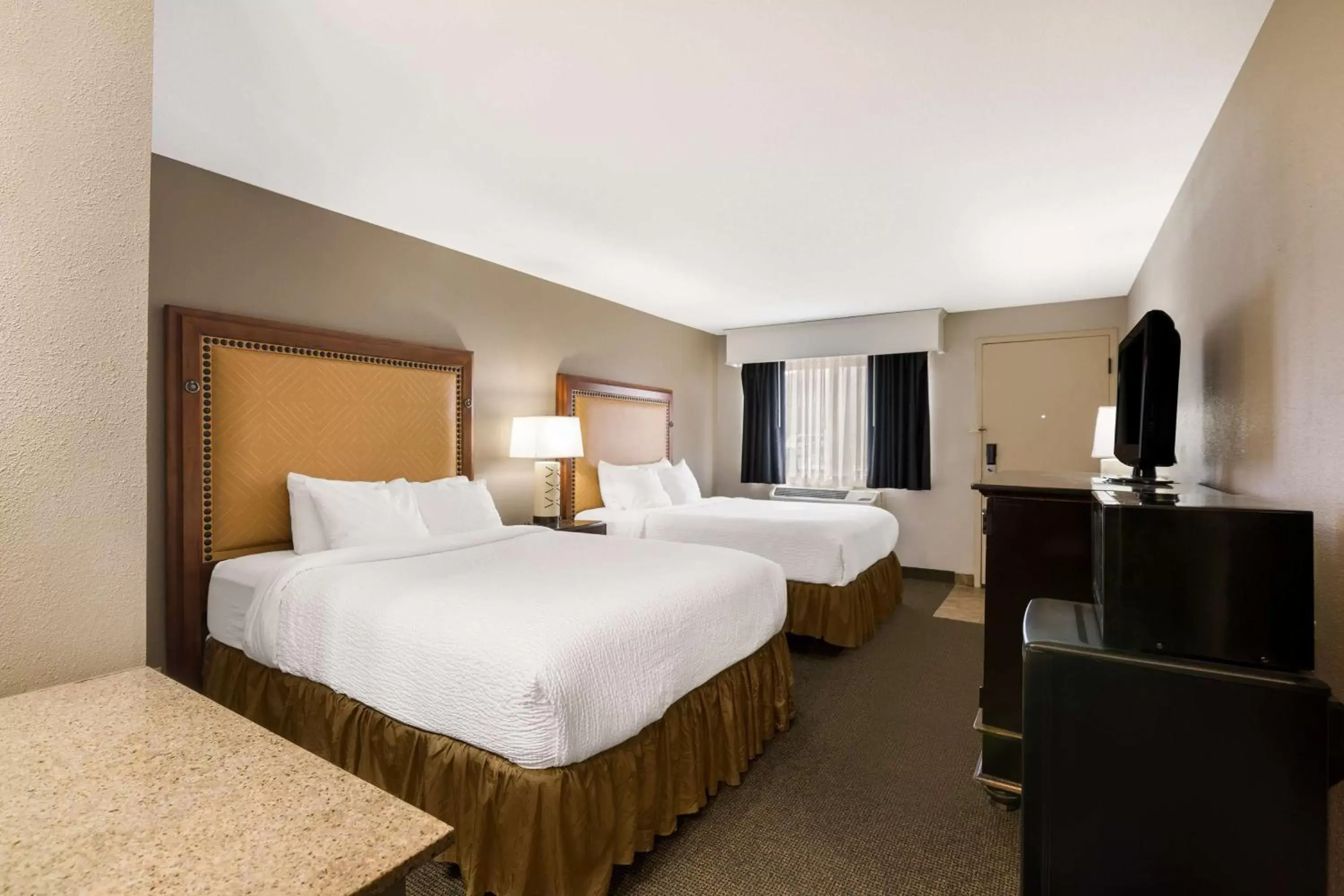 Queen Room with Two Queen Rooms - Non-Smoking in Revel Hotel Minot - SureStay Collection by Best Western