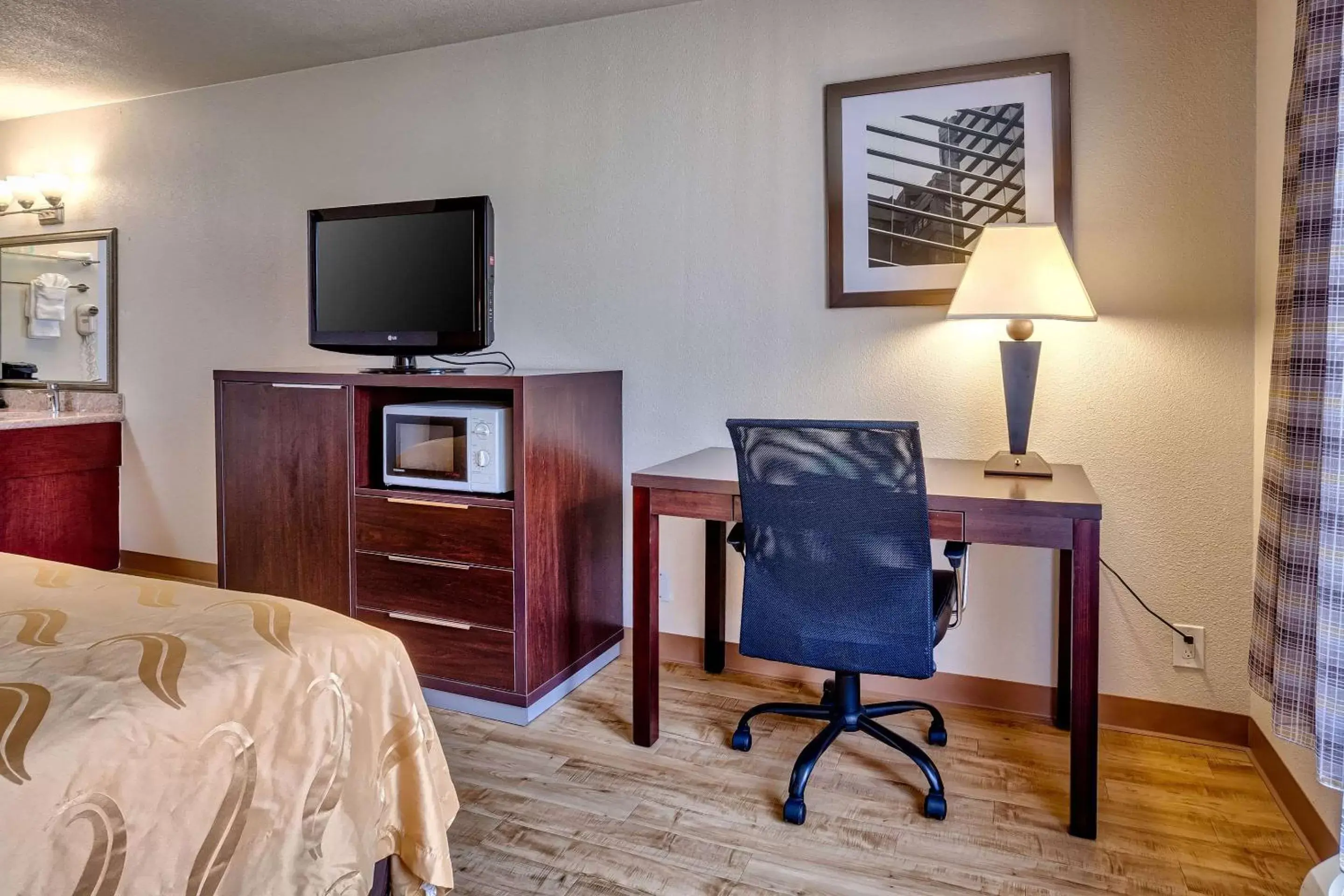 Photo of the whole room, TV/Entertainment Center in Quality Inn near Six Flags Discovery Kingdom-Napa Valley