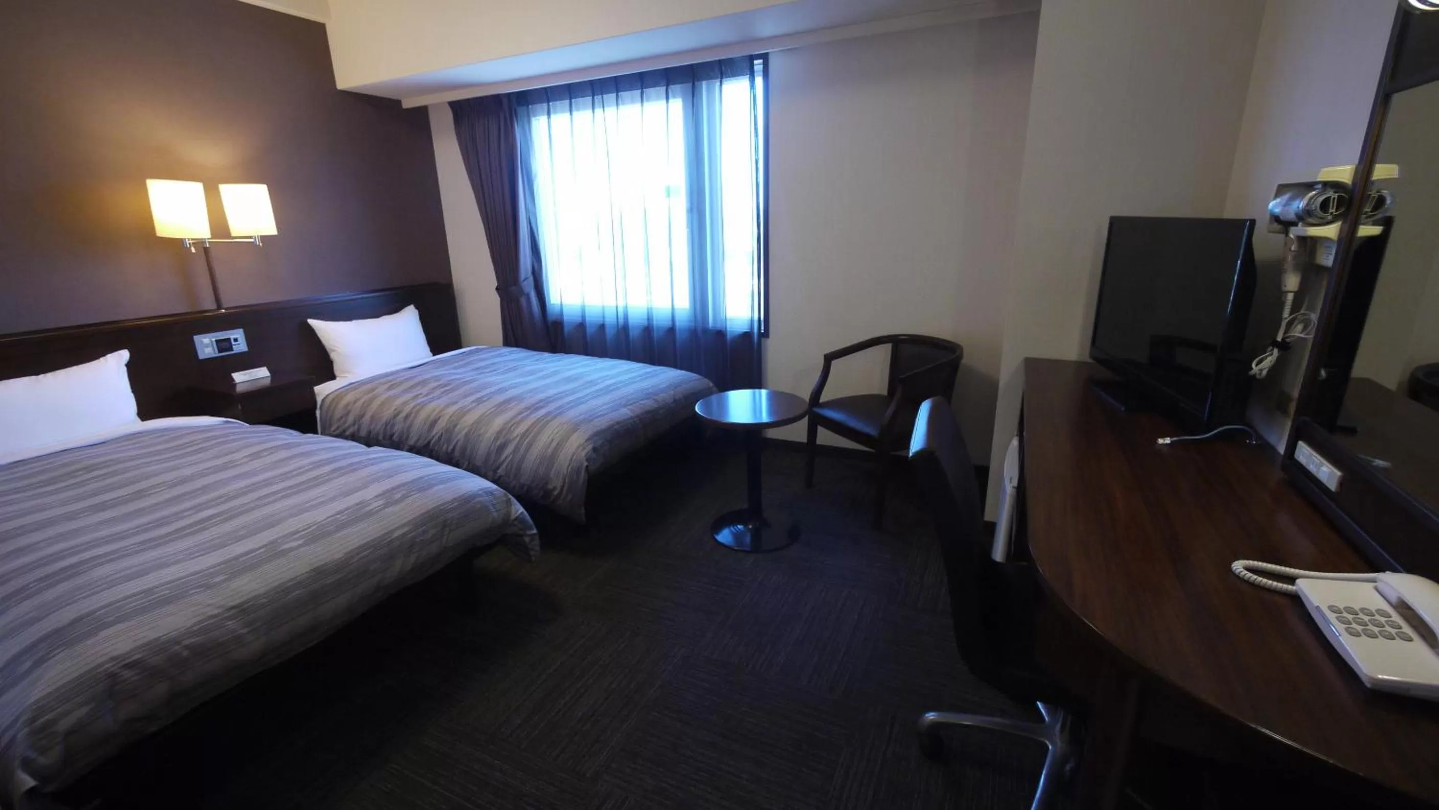Photo of the whole room, Bed in Hotel Route-Inn Nagahama Inter