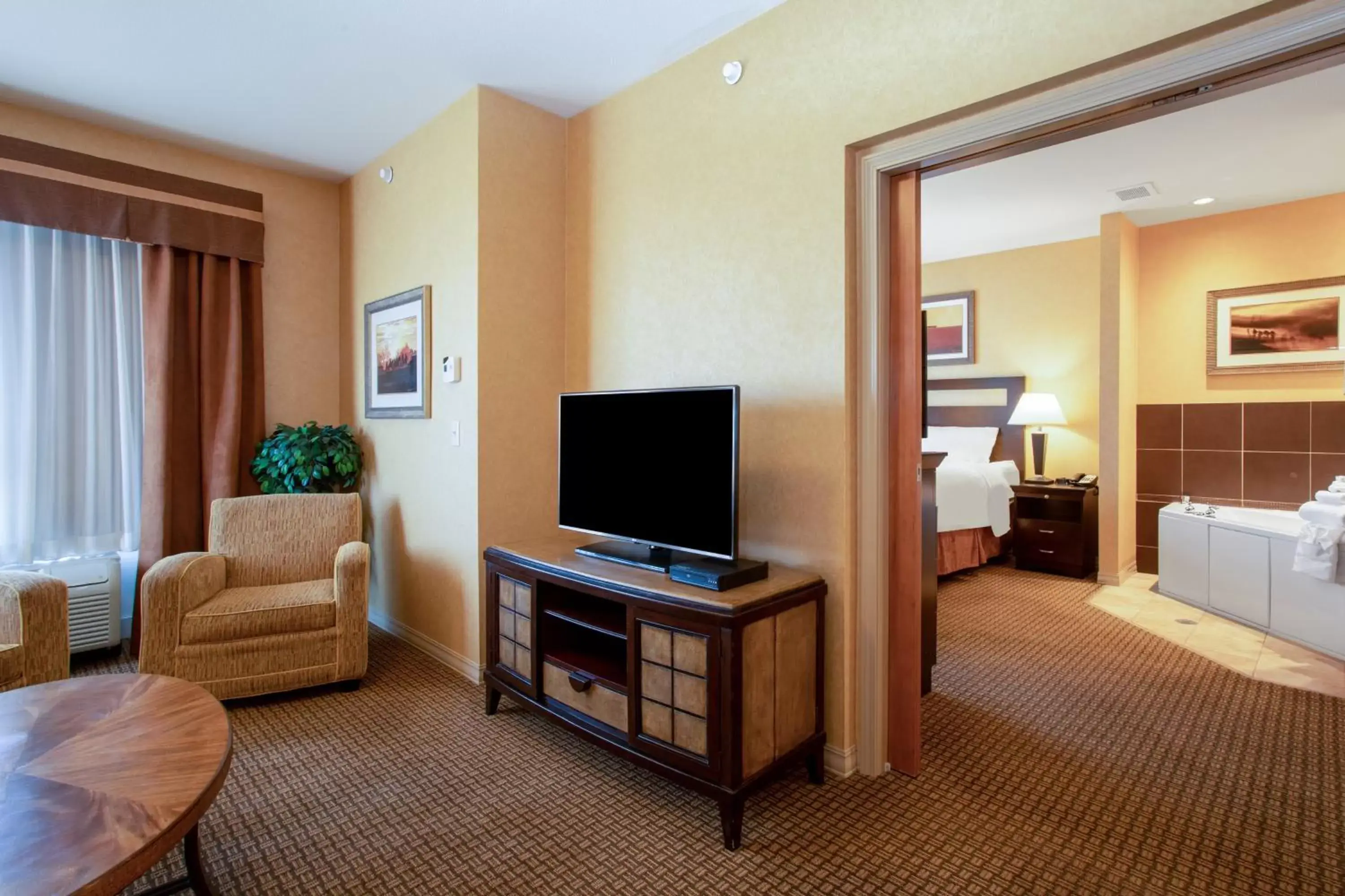 Photo of the whole room, TV/Entertainment Center in Holiday Inn Laramie, an IHG Hotel