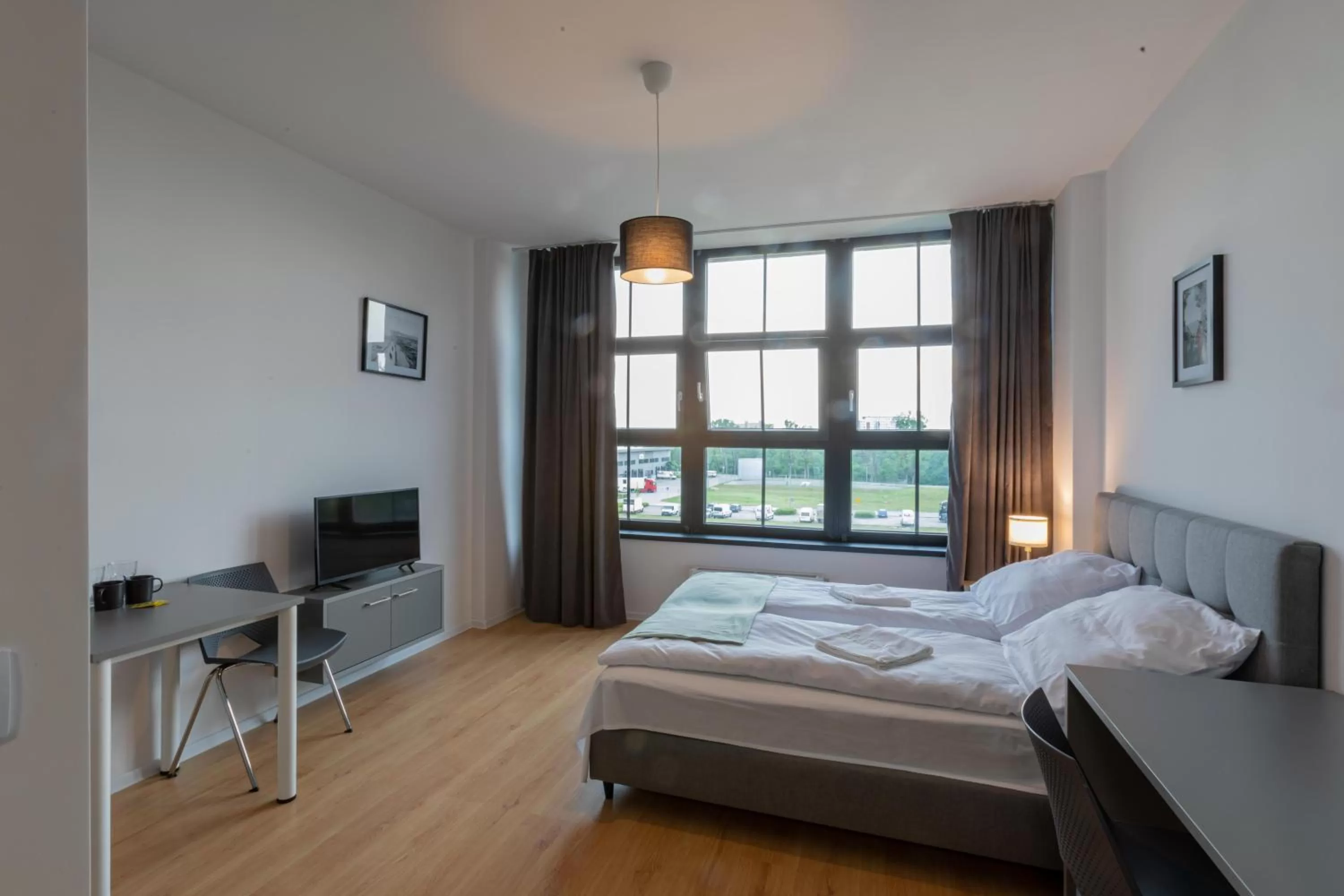 Bed in SleepWell Apartments