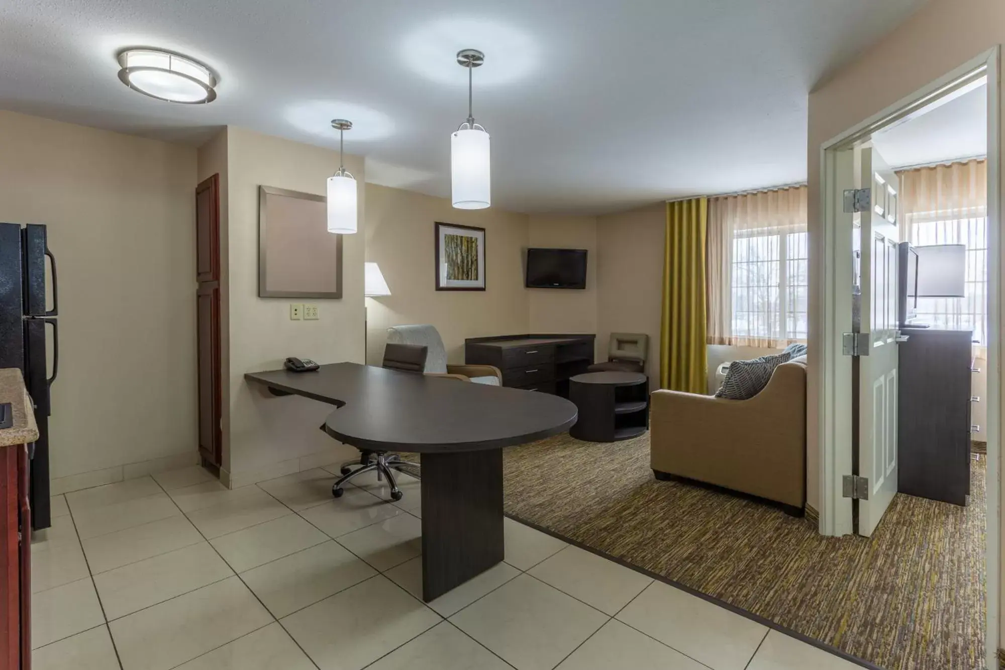 Living room, Dining Area in Candlewood Suites South Bend Airport, an IHG Hotel