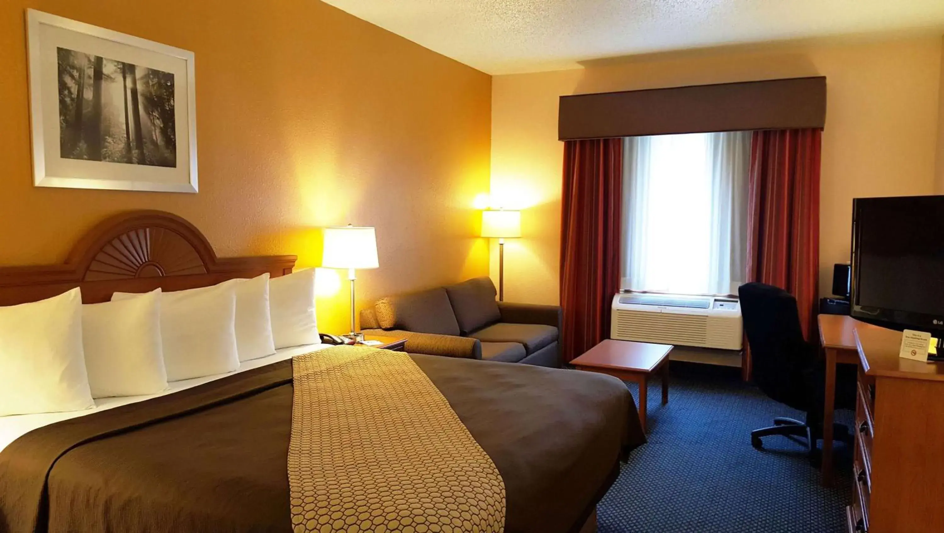 Photo of the whole room, Bed in Magnuson Hotel Sand Springs-Tulsa West