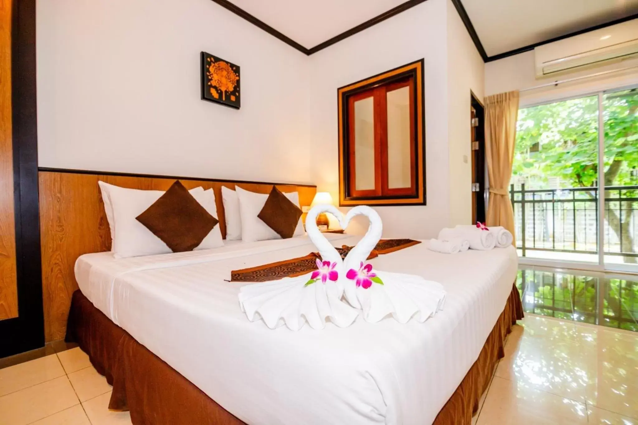 Bed in Rapeepan Ville Hotel