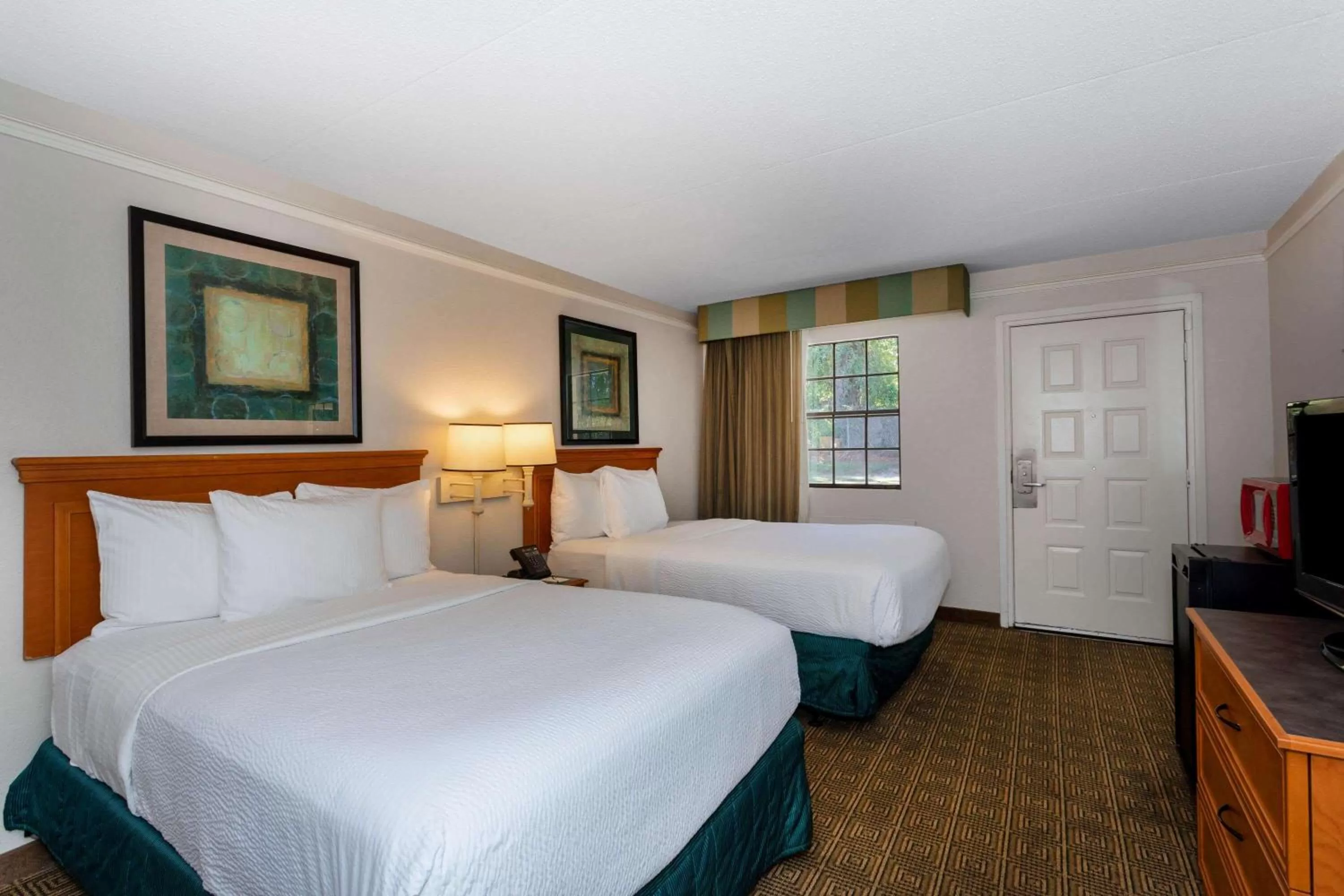 Photo of the whole room, Bed in La Quinta Inn by Wyndham Tallahassee North