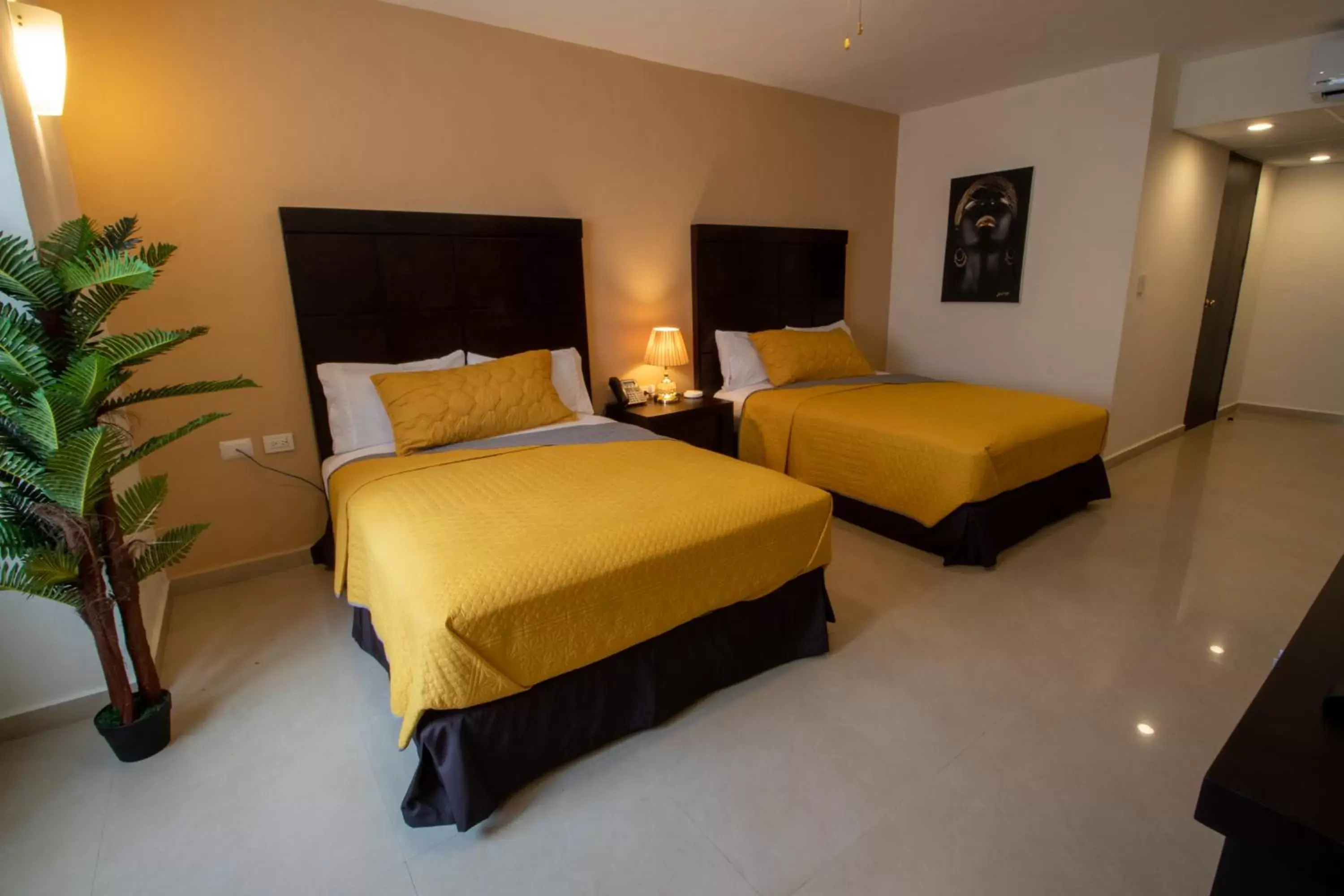 Bed in Hotel Villas Segovia Suites Playa del Carmen