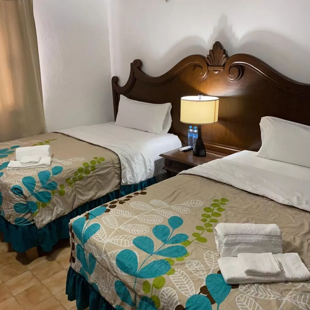 Bed in Cabo Tortuga Hotel Boutique