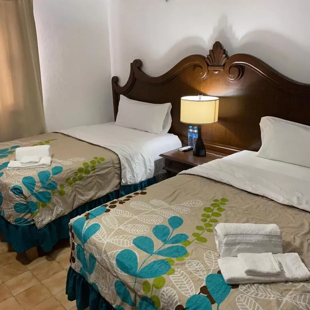 Bed in Cabo Tortuga Hotel Boutique