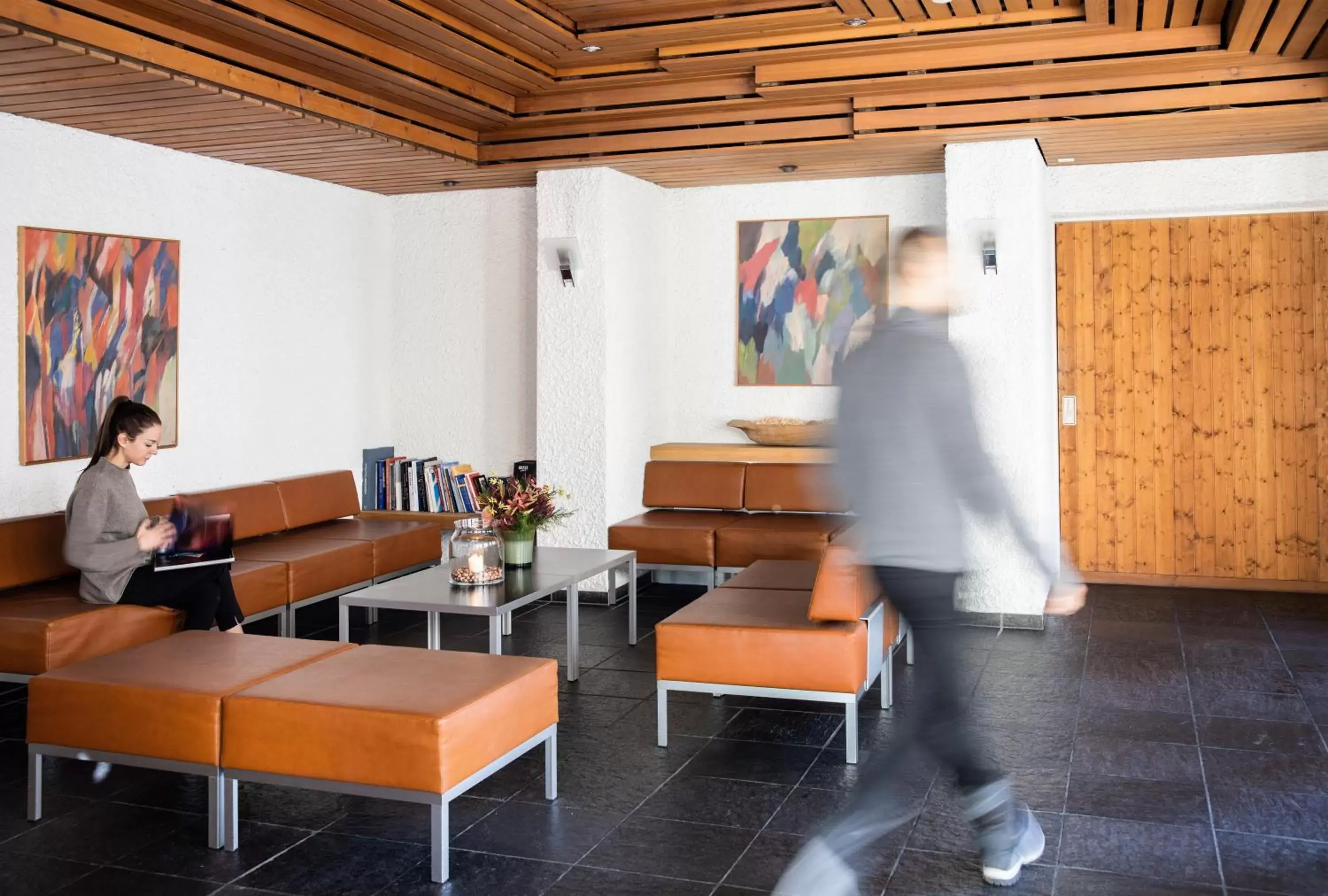 Communal lounge/ TV room in Hauser Hotel St. Moritz