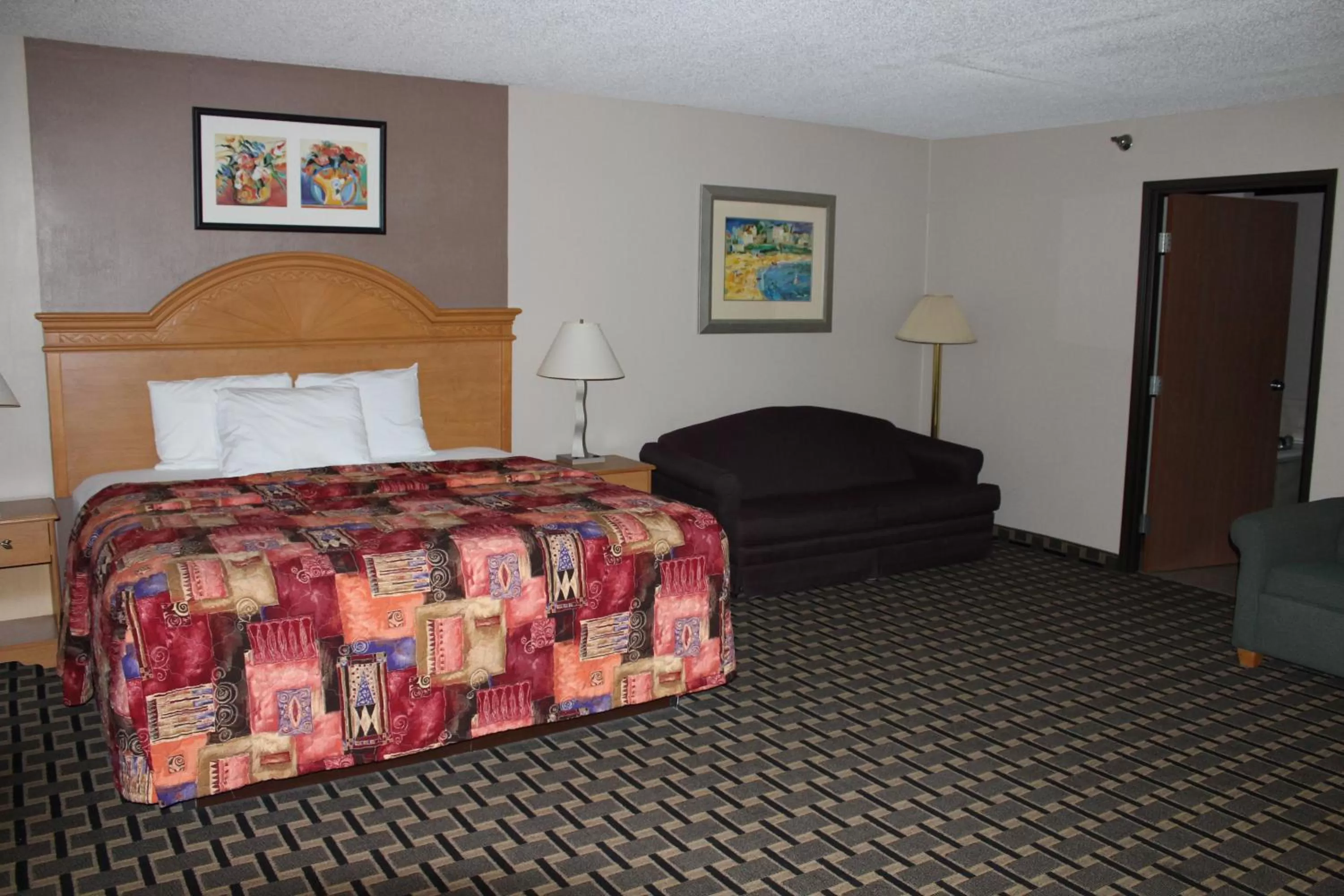 Bedroom, Bed in Coratel Inn and Suites Maple Grove
