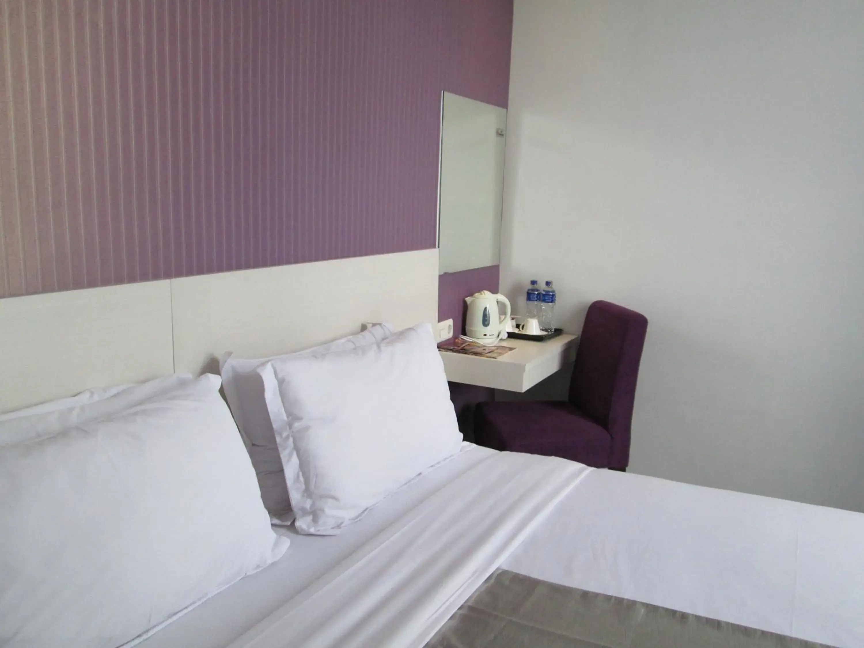 Bedroom, Bed in Vio Surapati - Managed By Dafam Hotels